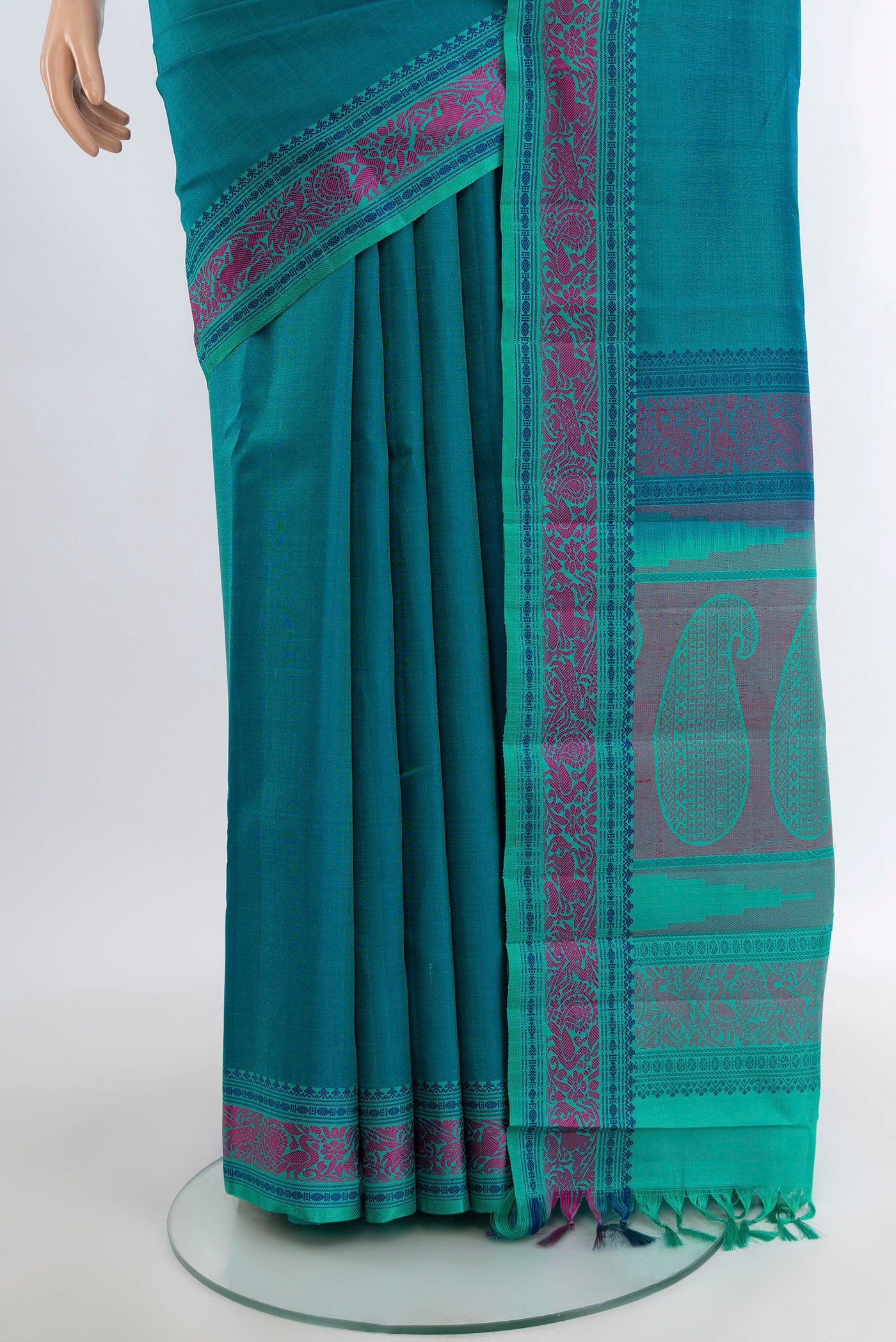 Pleats and pallu of Peacock Blue Kanchipuram Silk Saree with Plain Body and Thread Border. 