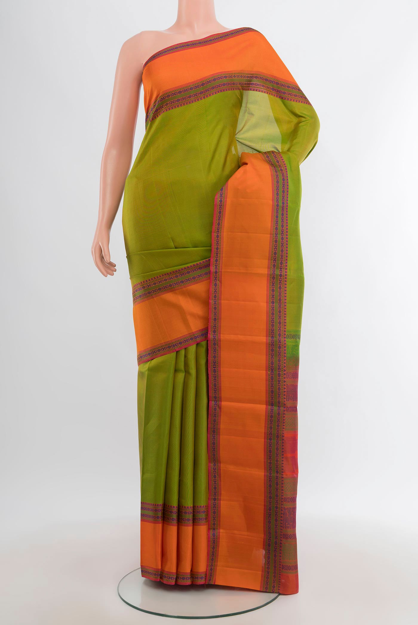 Green Kanchipuram Silk Saree with Plain Body and Thread Border.  displayed on a mannequin