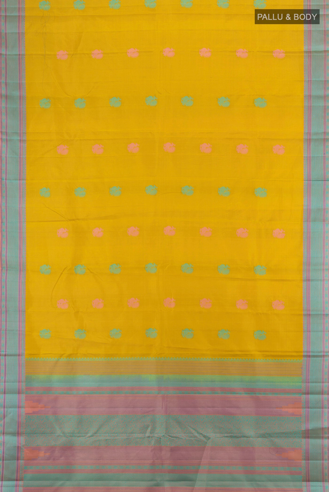 Flat view of Mustard Kanchipuram Silk Saree with Zari Butta on the body and Silk Border. 