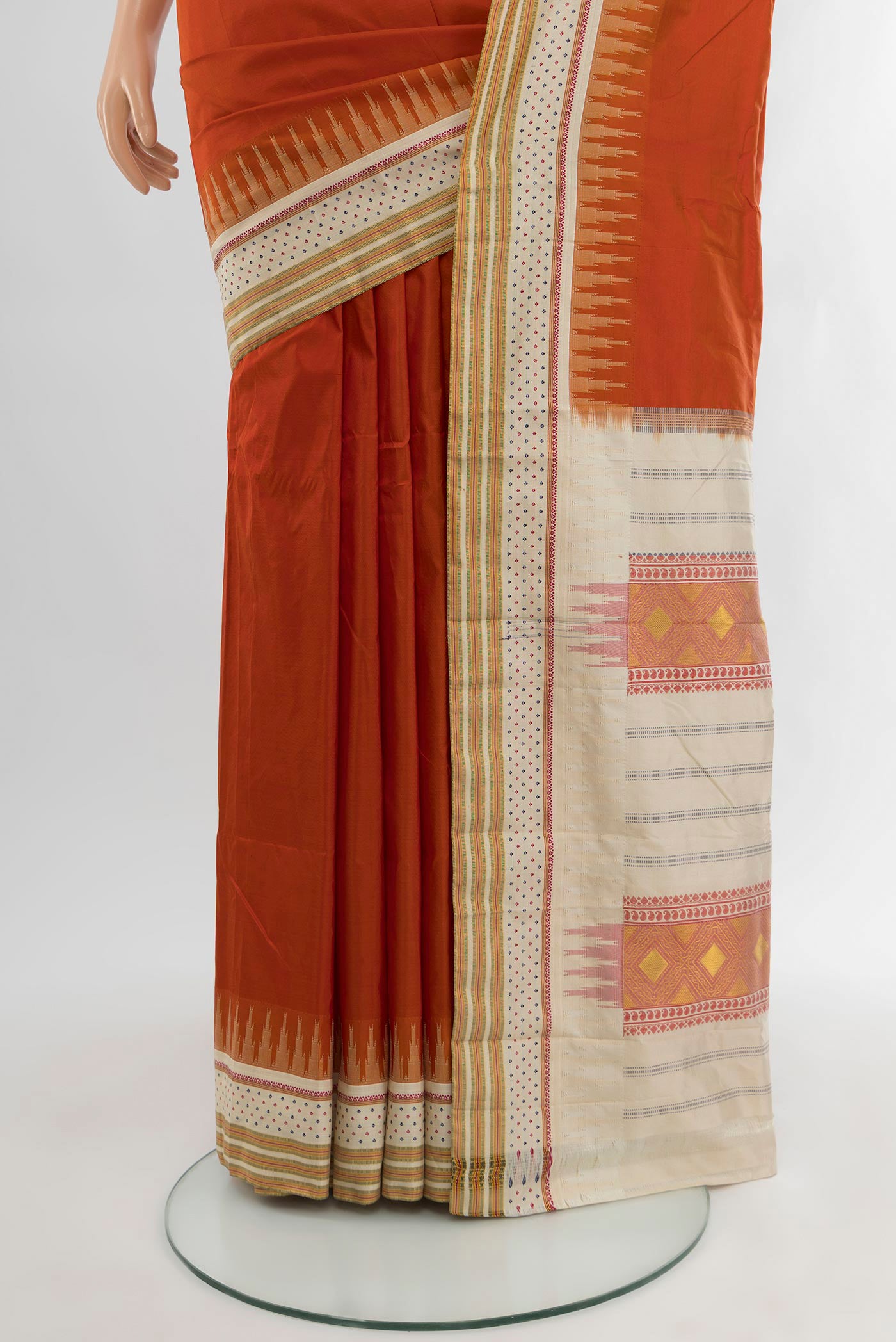 Pleats and pallu of Rust Bangalore Silk - kadyal Saree with Plain Body and Zari Border. 