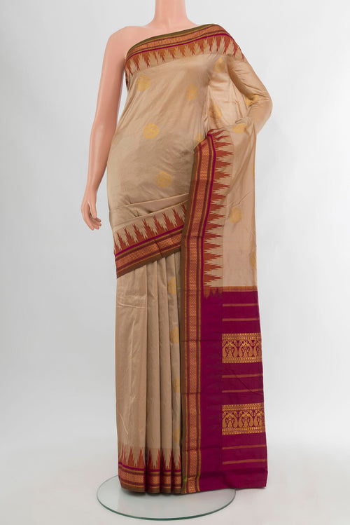 Beige Bangalore Silk - kadyal Saree with Zari Butta on the body and Zari Border.  displayed on a mannequin