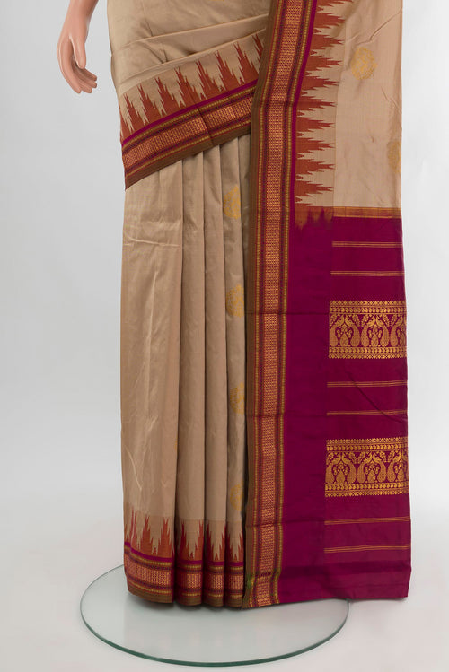 Pleats and pallu of Beige Bangalore Silk - kadyal Saree with Zari Butta on the body and Zari Border. 
