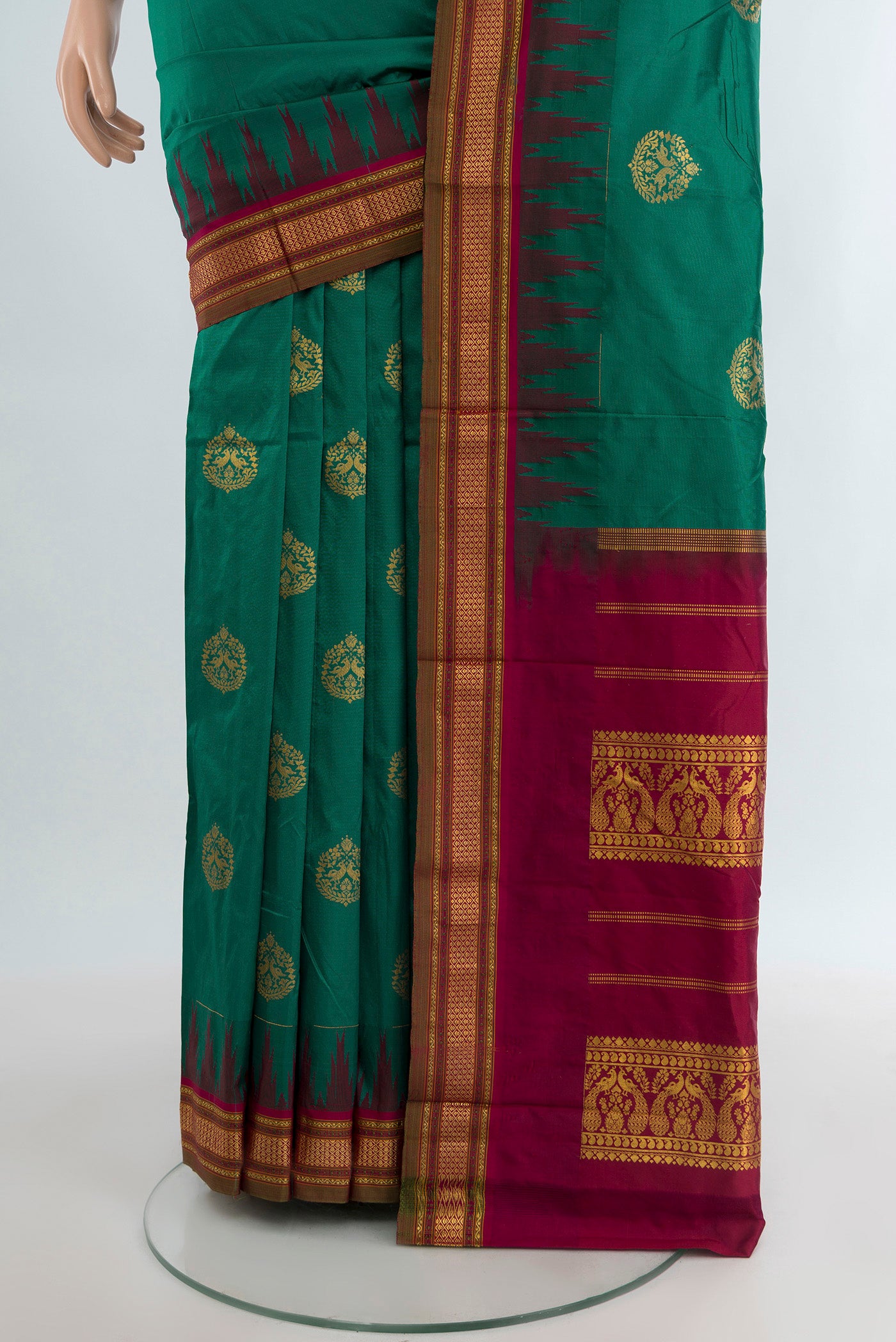 Pleats and pallu of Teal Bangalore Silk - kadyal Saree with Zari Butta on the body and Temple Border. 