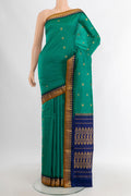 Teal Bangalore Silk - kadyal Saree with Zari Butta on the body and Zari Border.  displayed on a mannequin