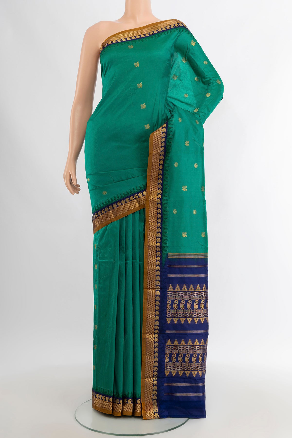 Teal Bangalore Silk - kadyal Saree with Zari Butta on the body and Zari Border.  displayed on a mannequin