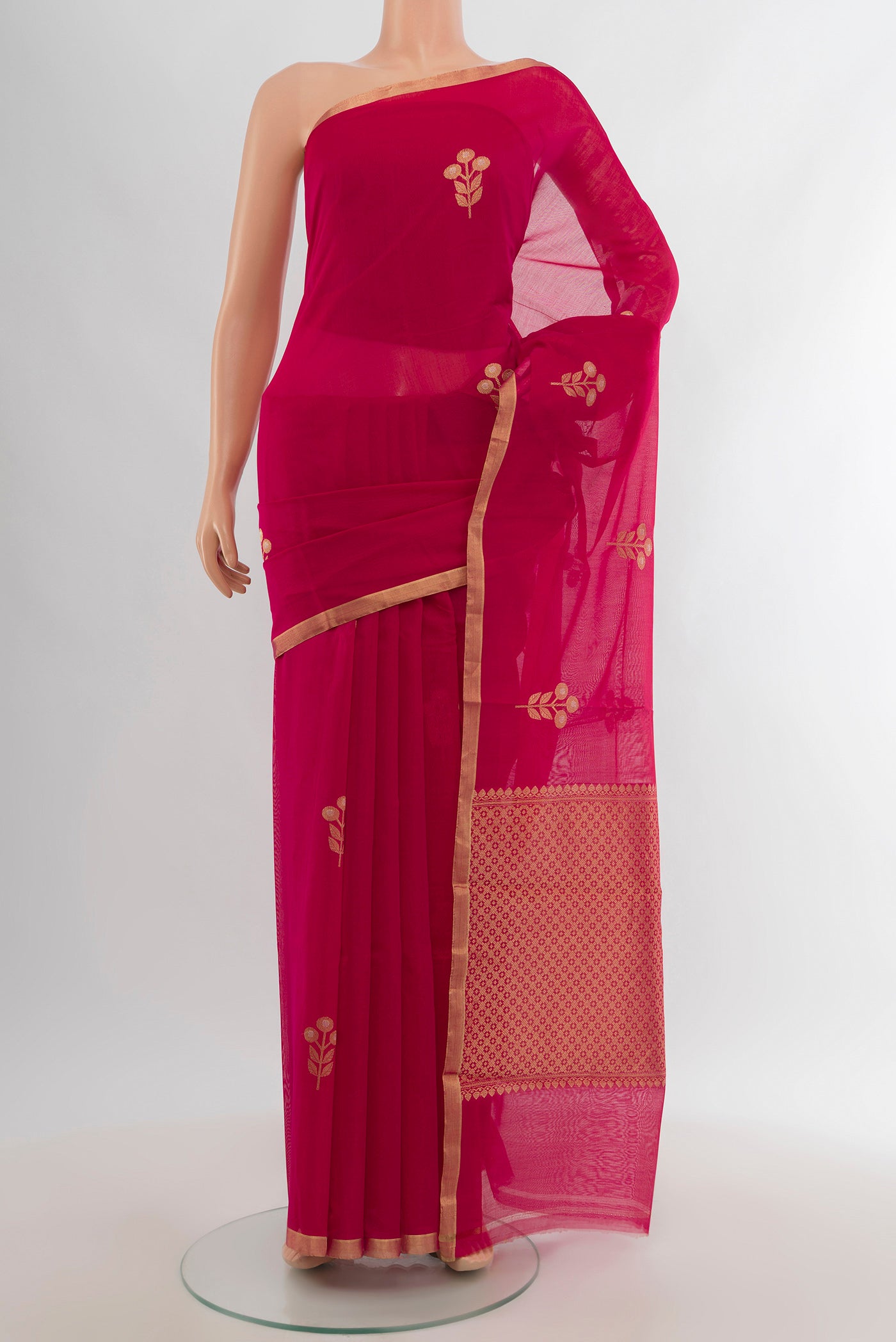 Dark Pink Banarasi Kora Cotton Saree with Zari Butta on the body and Zari Border.  displayed on a mannequin
