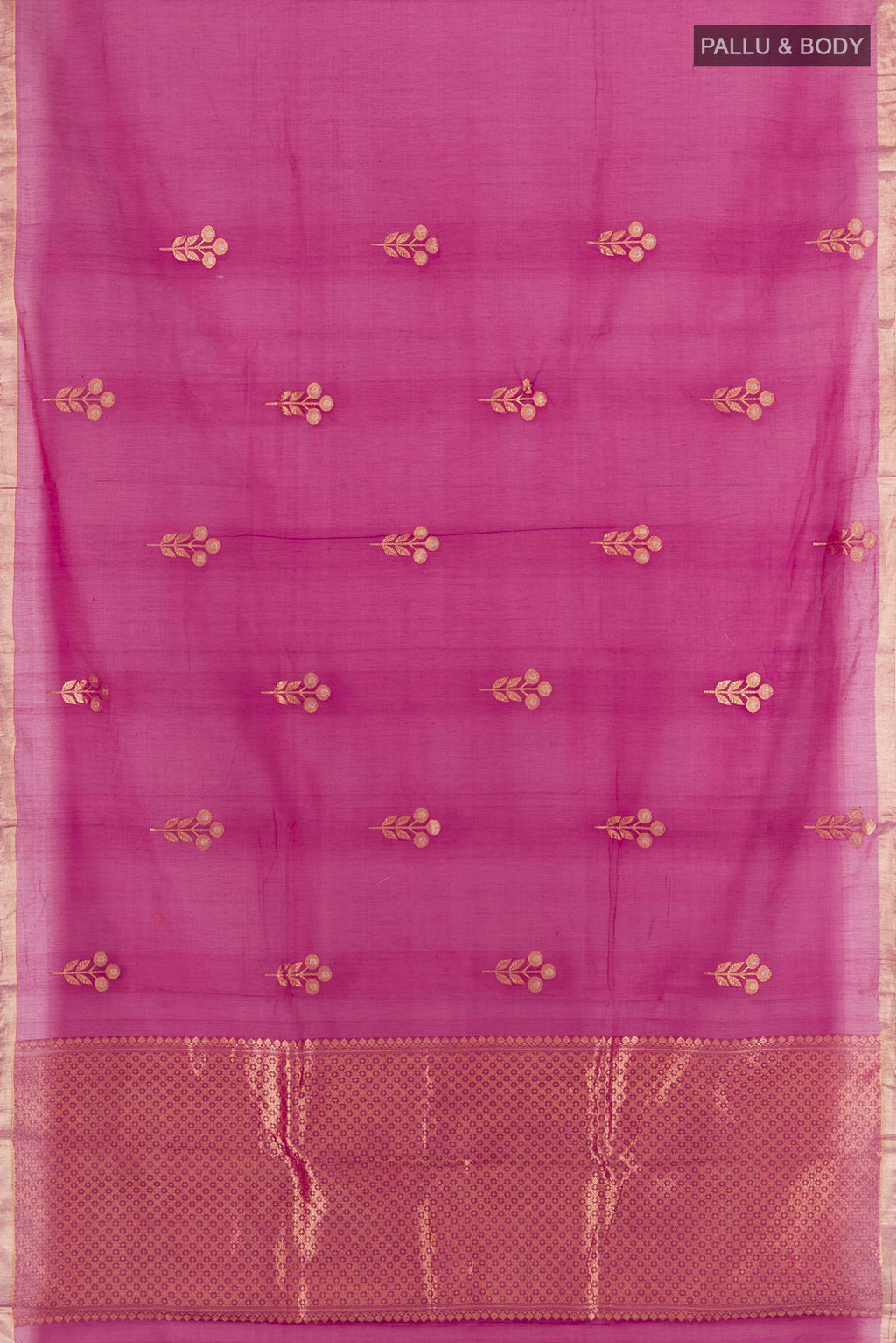 Flat view of Magenta Banarasi Kora Cotton Saree with Zari Butta on the body and Zari Border. 