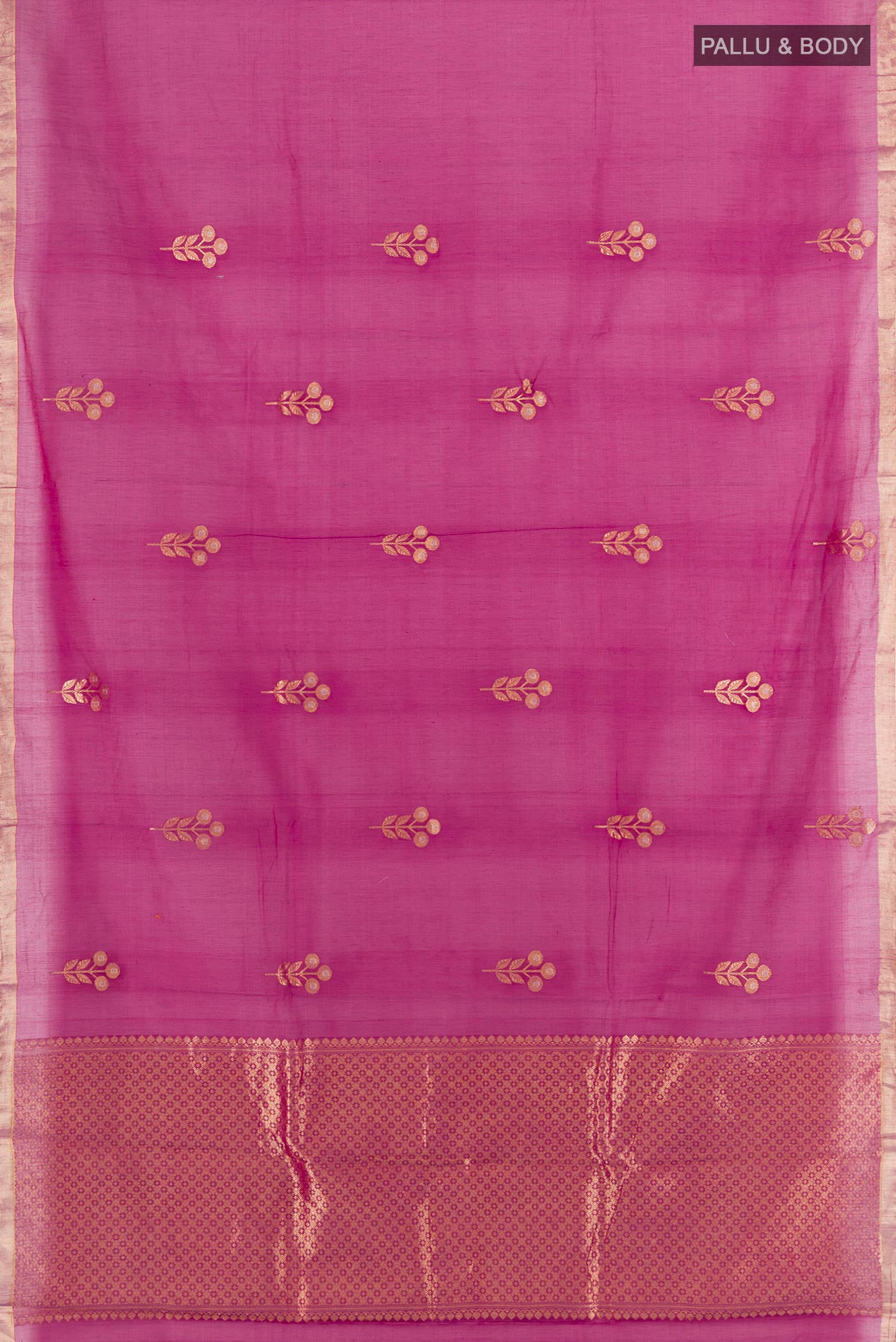 Flat view of Magenta Banarasi Kora Cotton Saree with Zari Butta on the body and Zari Border. 