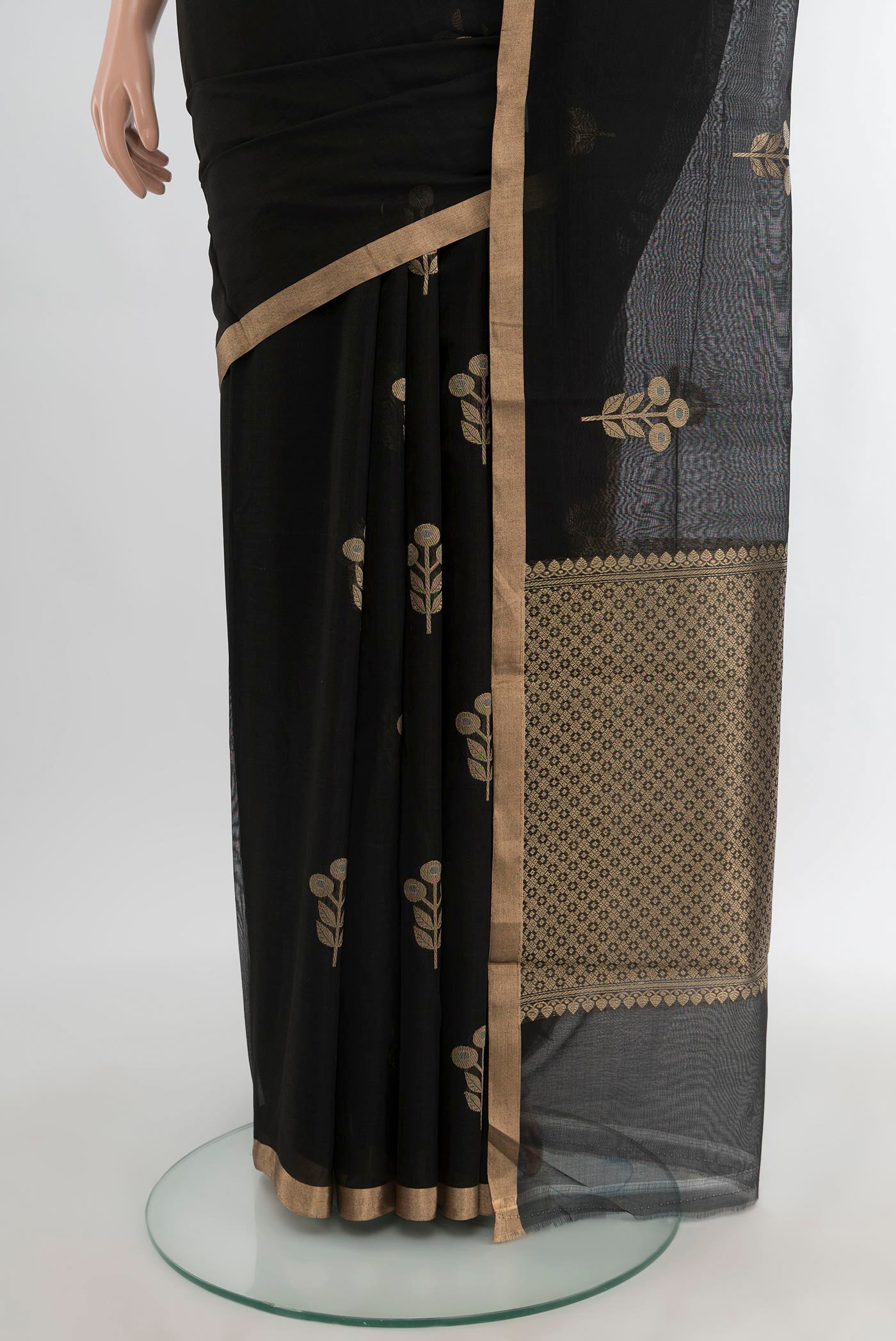 Pleats and pallu of Black Banarasi Kora Cotton Saree with Zari Butta on the body and Zari Border. 