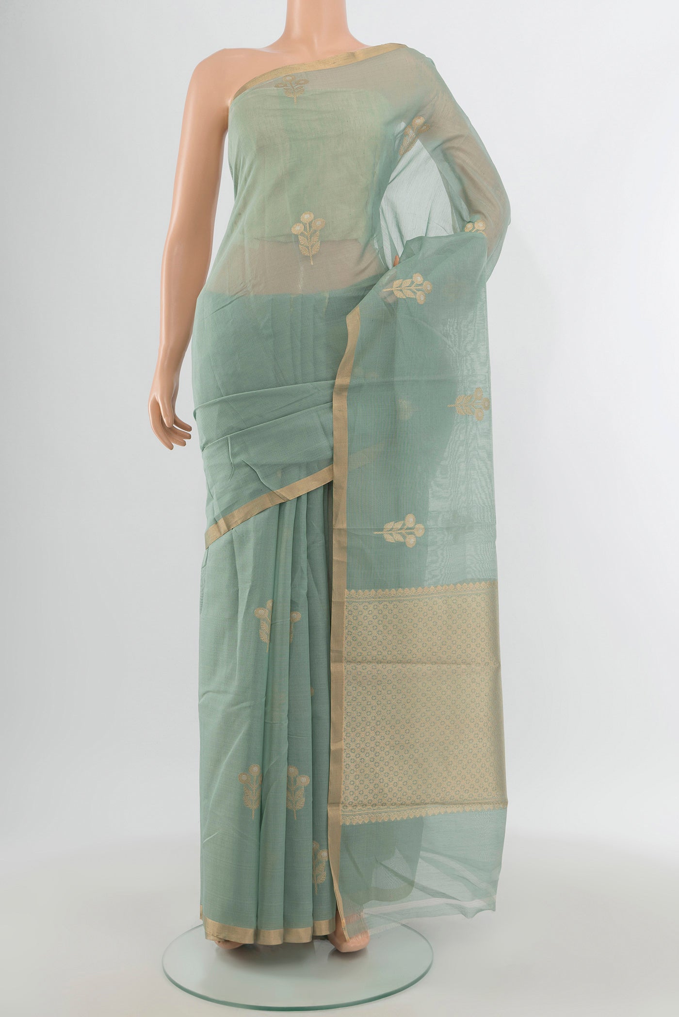 Grey Banarasi Kora Cotton Saree with Zari Butta on the body and Zari Border.  displayed on a mannequin