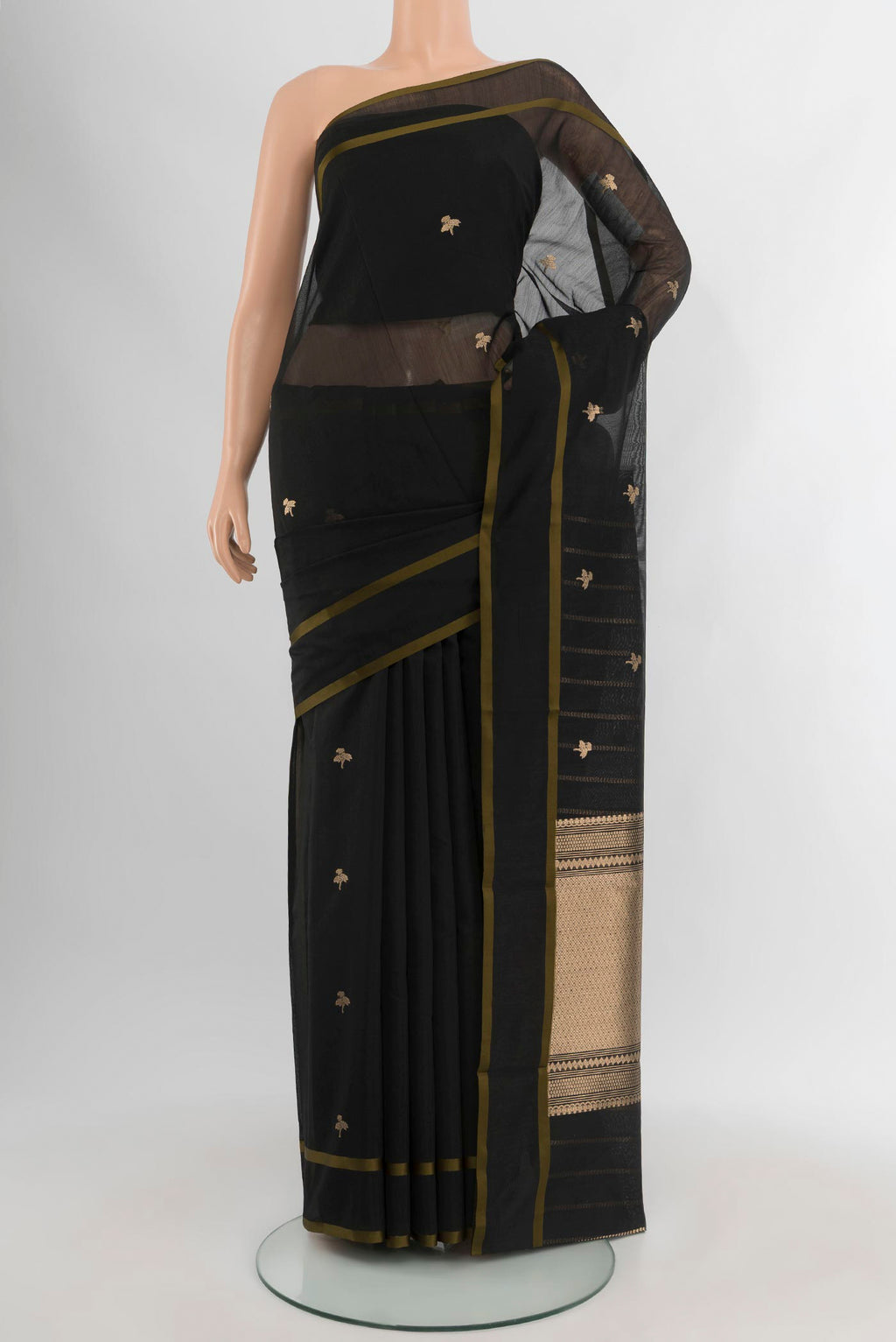 Black Banarasi Kora Cotton Saree with Zari Butta on the body and Zari Border.  displayed on a mannequin