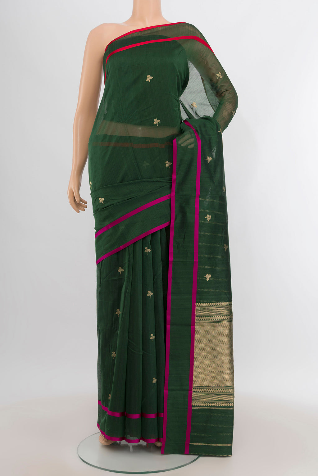 Bottle Green Banarasi Kora Cotton Saree with Zari Butta on the body and Plain Border.  displayed on a mannequin