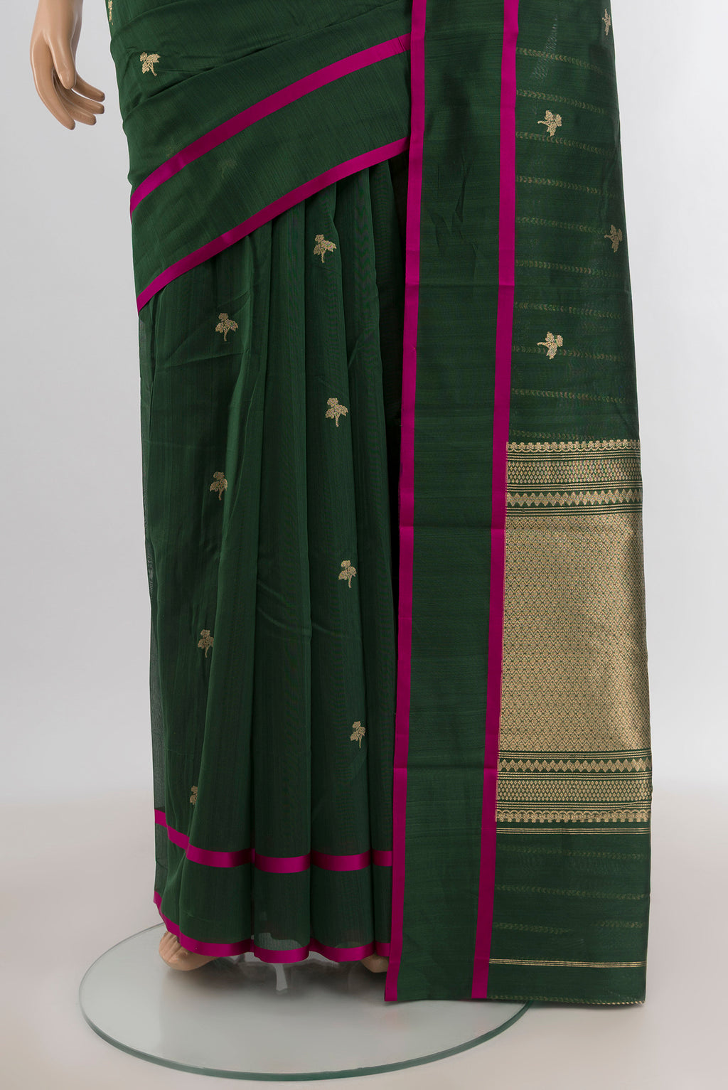 Pleats and pallu of Bottle Green Banarasi Kora Cotton Saree with Zari Butta on the body and Plain Border. 