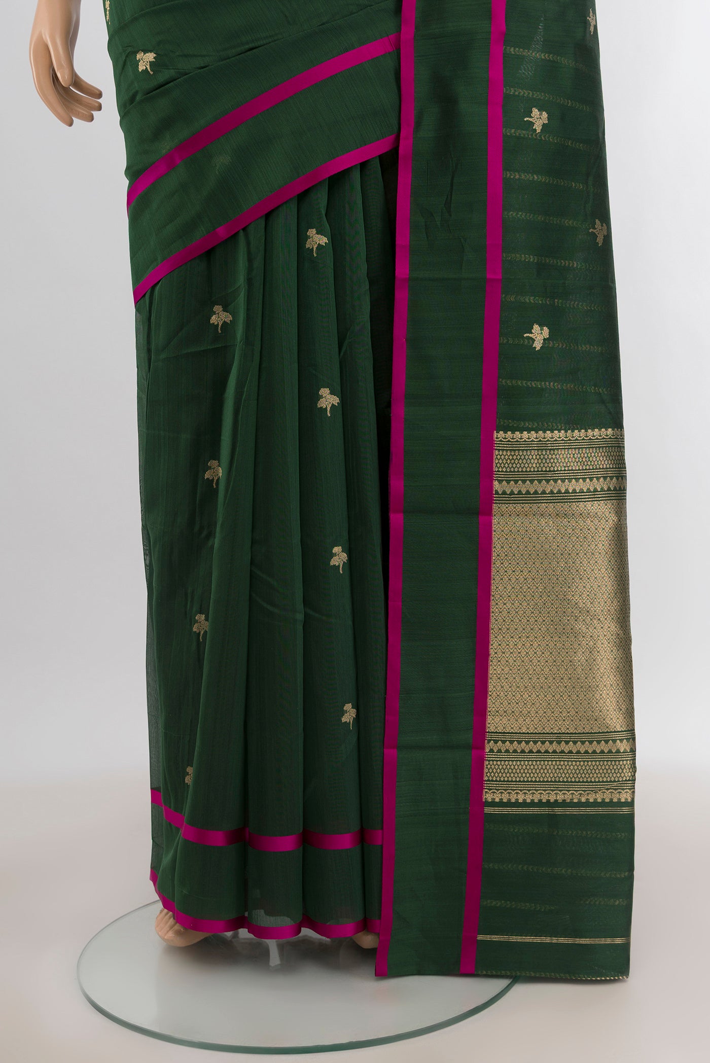 Pleats and pallu of Bottle Green Banarasi Kora Cotton Saree with Zari Butta on the body and Plain Border. 