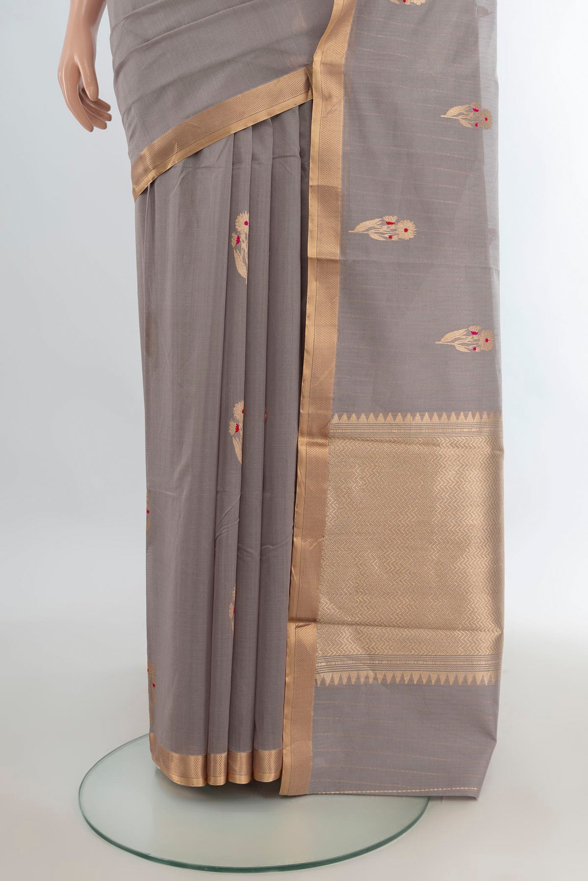 Pleats and pallu of Grey Banarasi Kora Cotton Saree with Zari Butta on the body and Zari Border. 