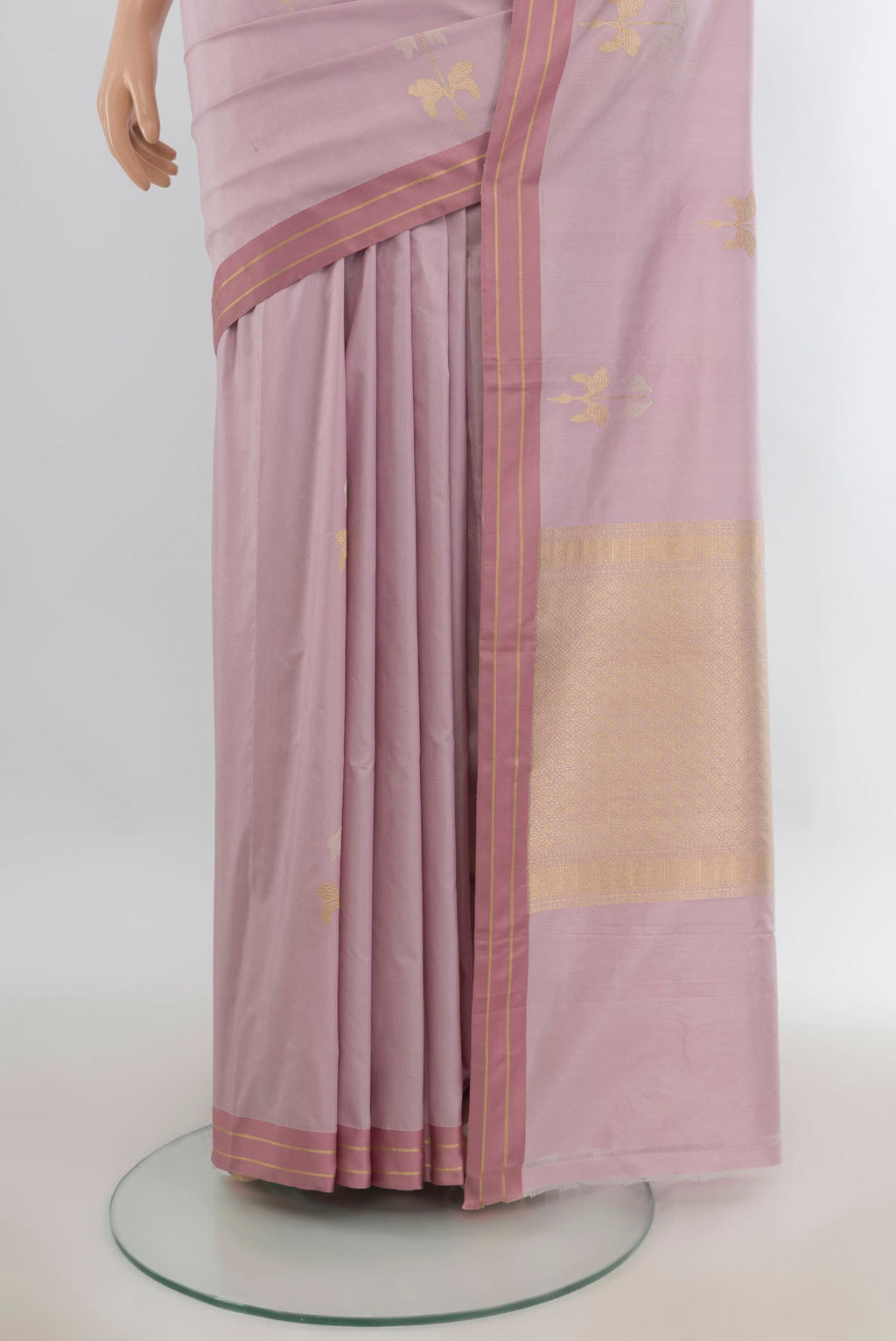 Pleats and pallu of Pure Silk Rose Gold Banarasi Katan Saree with Zari Butta on the body and Plain Border. 