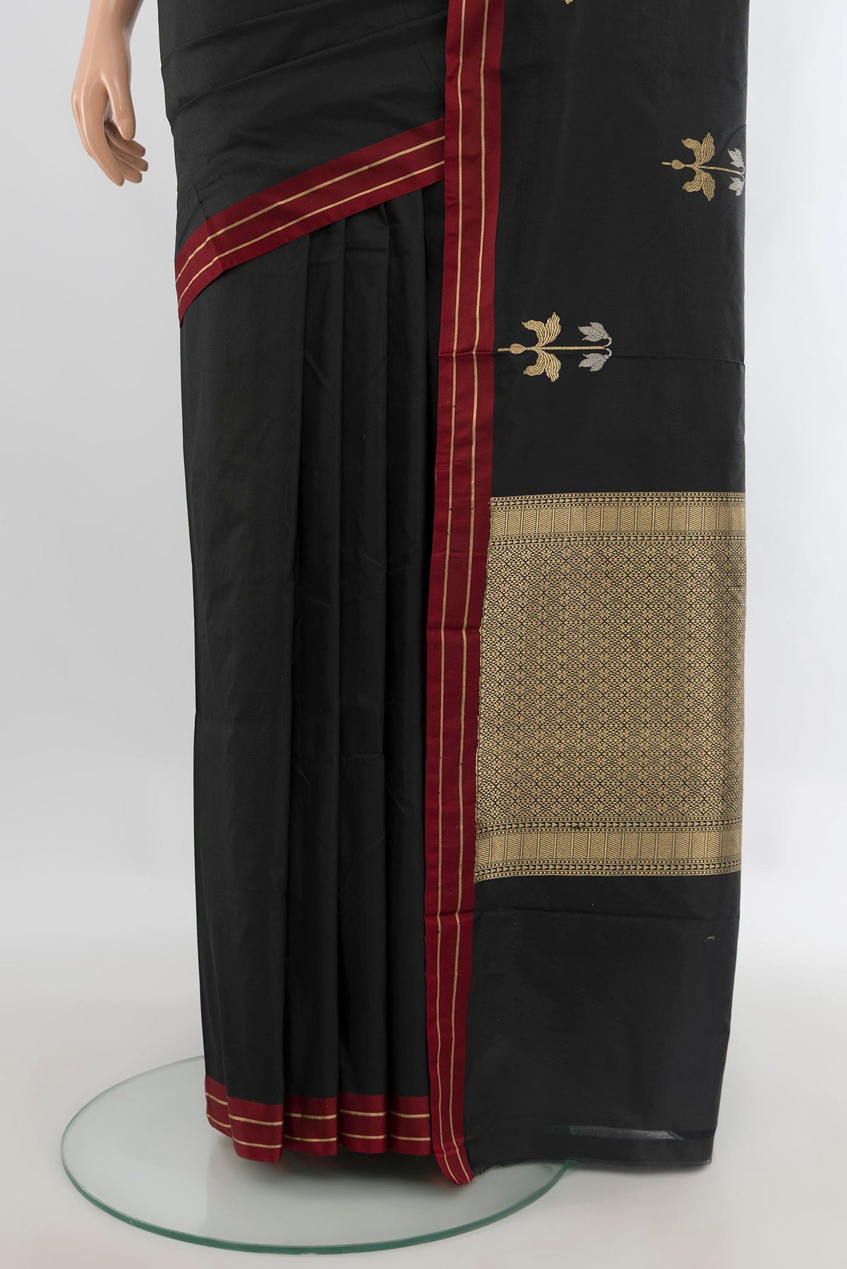 Pleats and pallu of Pure Silk Black Banarasi Katan Saree with Zari Butta on the body and Plain Border. 