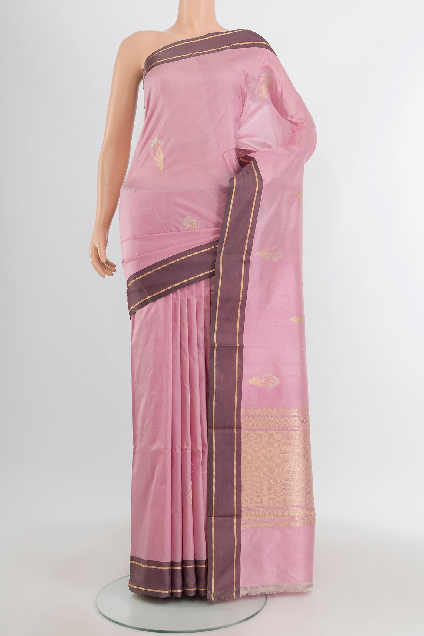 Rose pink Banarasi Katan Silk Saree with Zari Butta on the body and Plain Border.  displayed on a mannequin