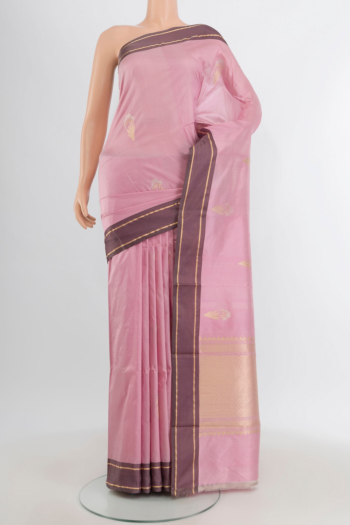 Rose pink Banarasi Katan Silk Saree with Zari Butta on the body and Plain Border.  displayed on a mannequin