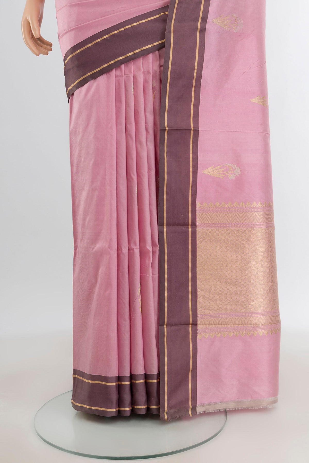 Pleats and pallu of Rose pink Banarasi Katan Silk Saree with Zari Butta on the body and Plain Border. 