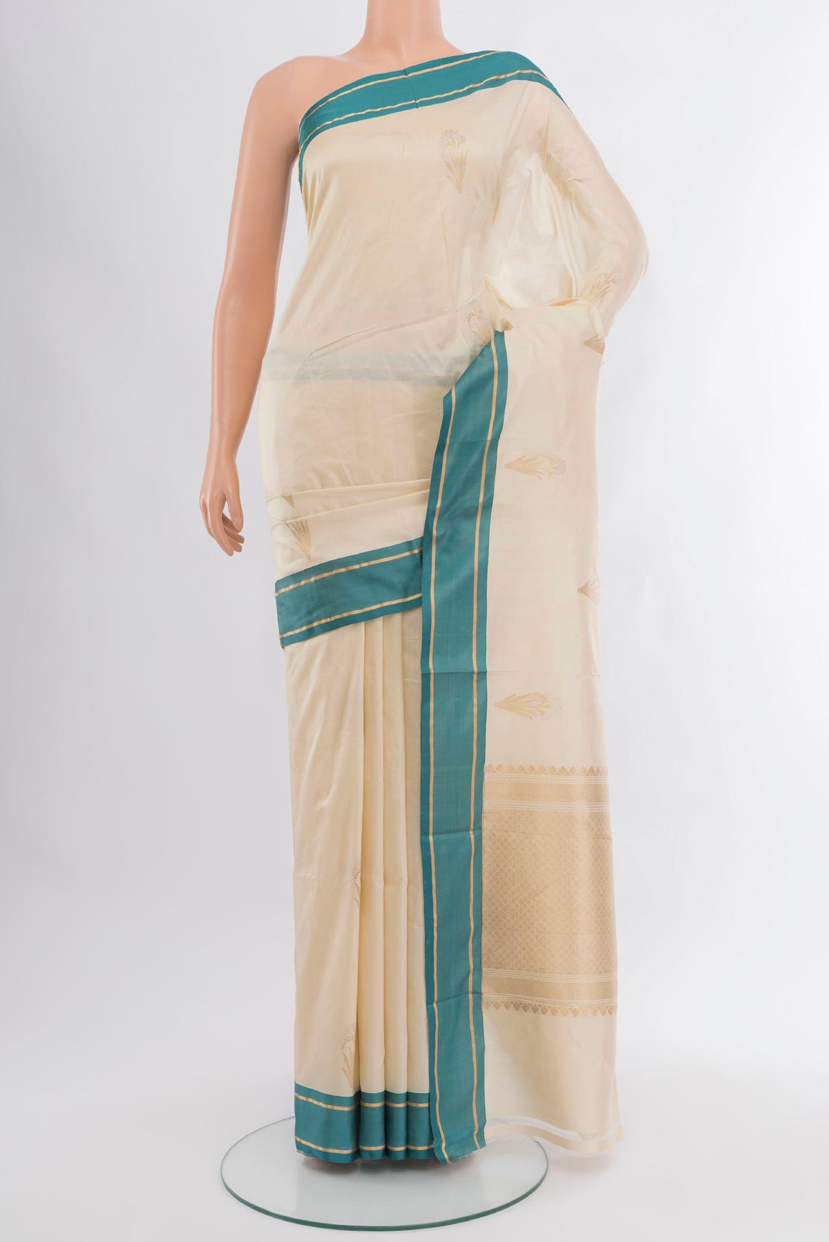 Cream Banarasi Katan Silk Saree with Zari Butta on the body and Plain Border.  displayed on a mannequin