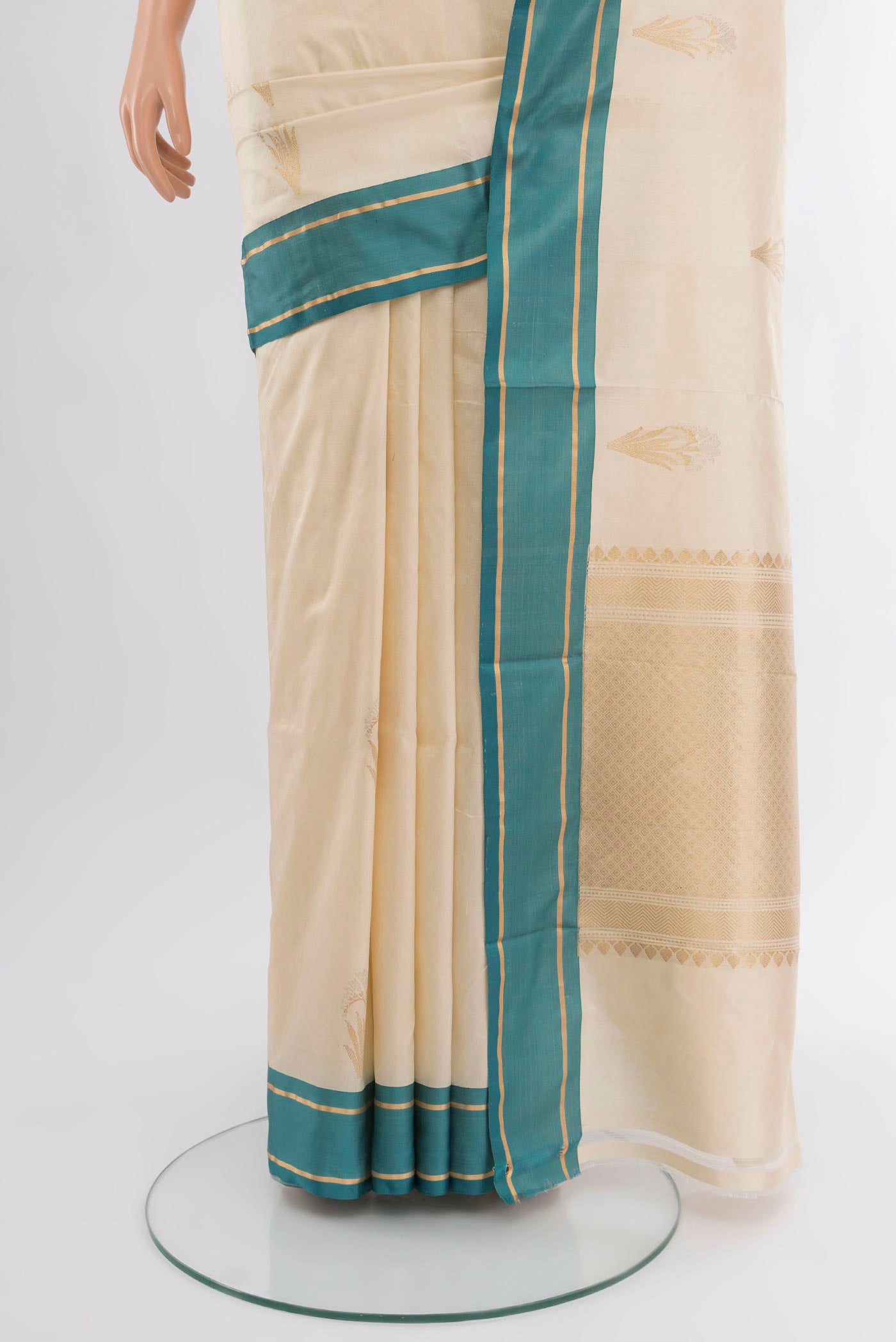 Pleats and pallu of Cream Banarasi Katan Silk Saree with Zari Butta on the body and Plain Border. 