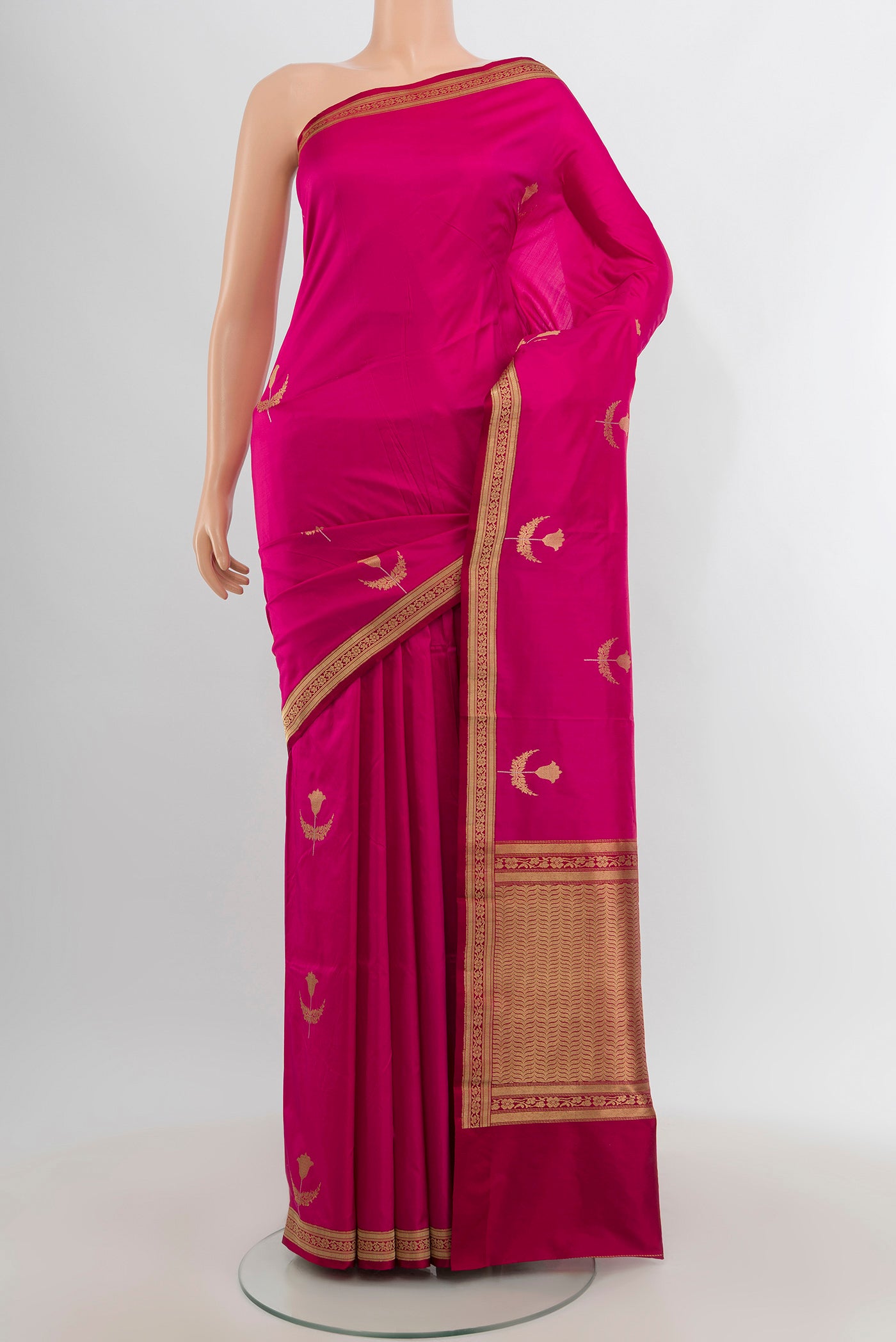 Dark Pink Banarasi Katan Silk Saree with Zari Butta on the body and Zari Border.  displayed on a mannequin