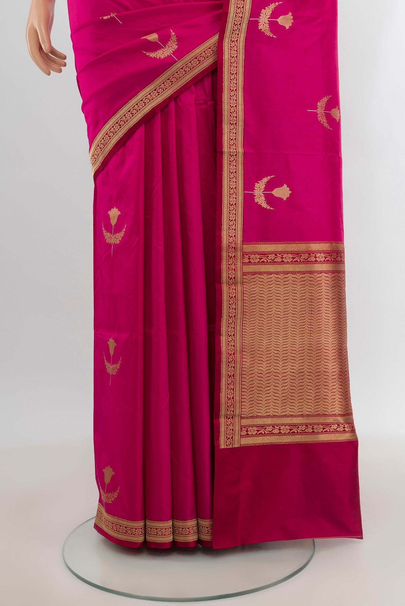 Pleats and pallu of Dark Pink Banarasi Katan Silk Saree with Zari Butta on the body and Zari Border. 