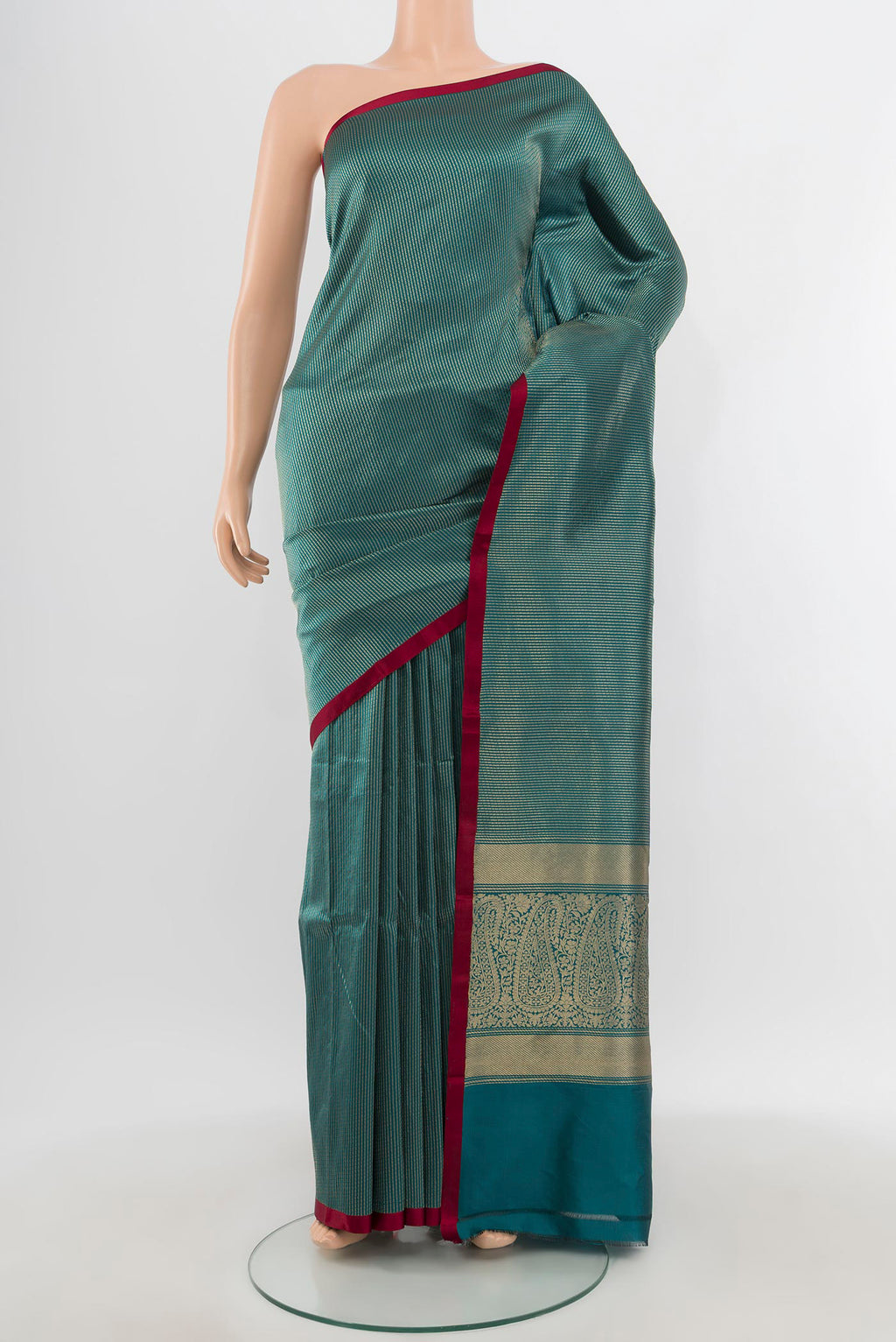 Peacock Blue Banarasi Katan Silk Saree with Stripes on the body and Plain Border.  displayed on a mannequin