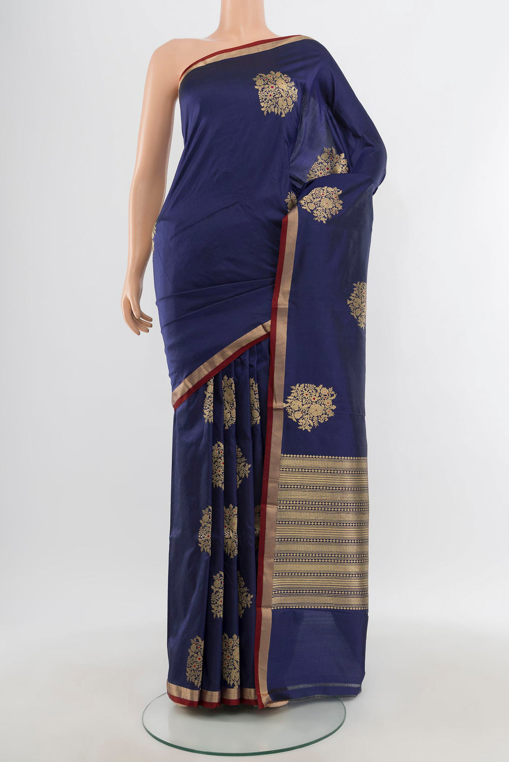 Navy Blue Banarasi Katan Silk Saree with Zari Butta on the body and Zari Border.  displayed on a mannequin
