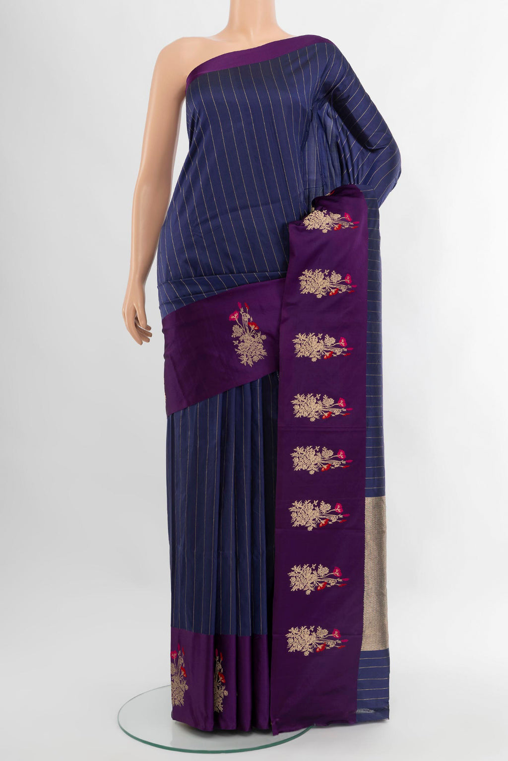 Navy Blue Banarasi Katan Silk Saree with Stripes on the body and Zari Border.  displayed on a mannequin