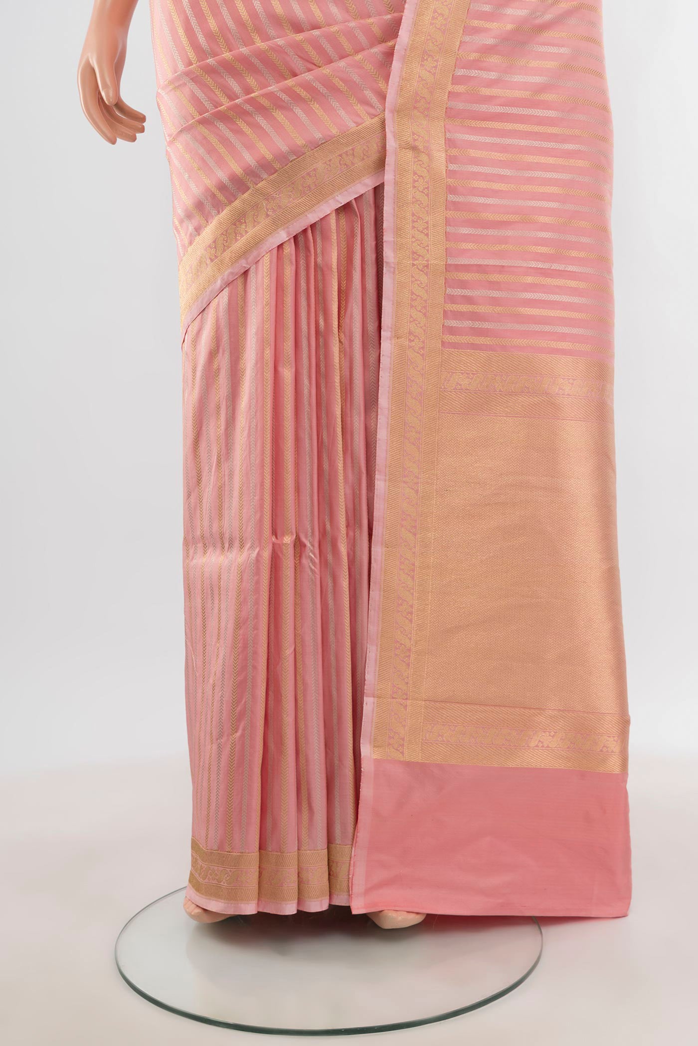 Pleats and pallu of Peach Banarasi Katan Silk Saree with Stripes on the body and Zari Border. 