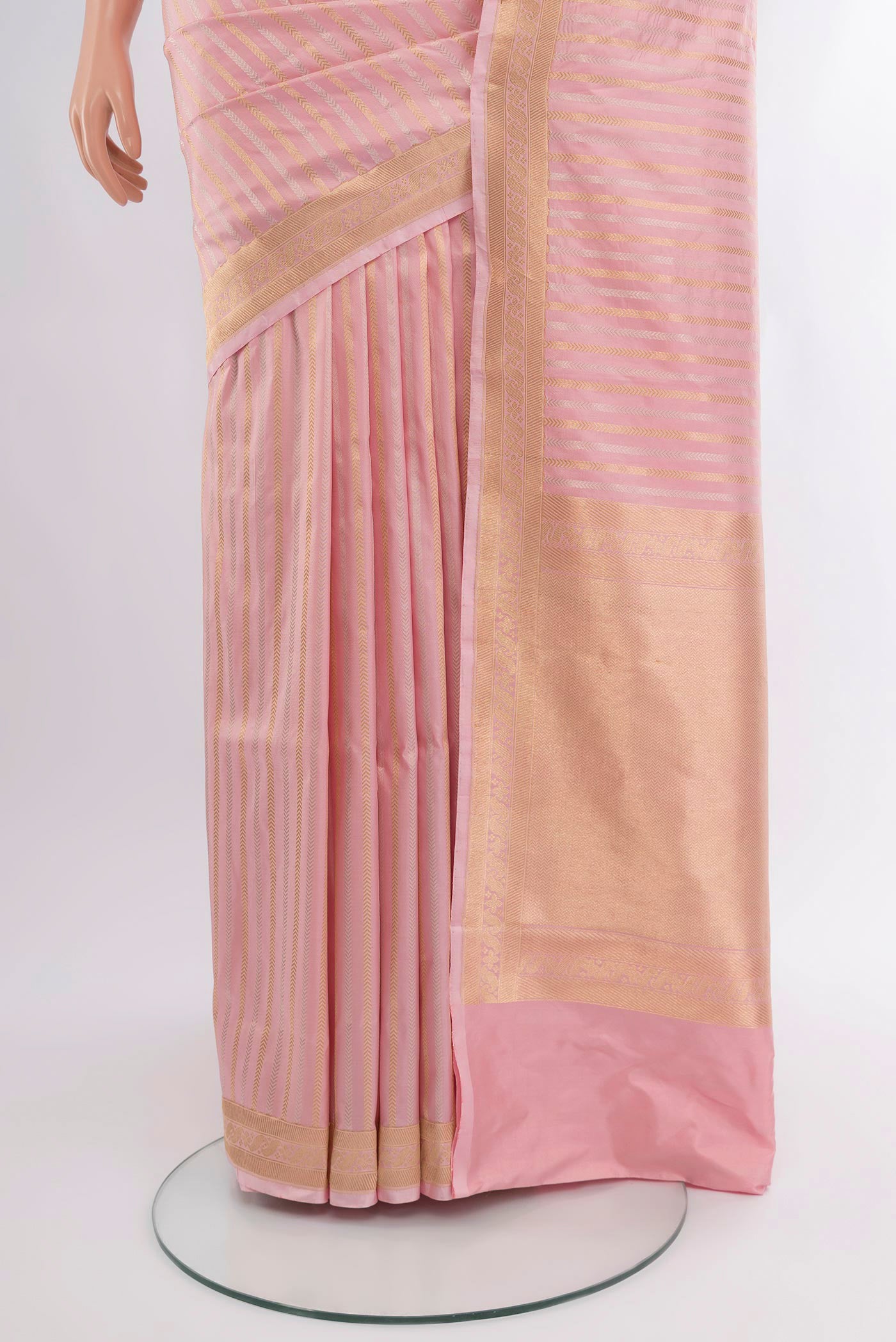 Pleats and pallu of Rose pink Banarasi Katan Silk Saree with Stripes on the body and Zari Border. 