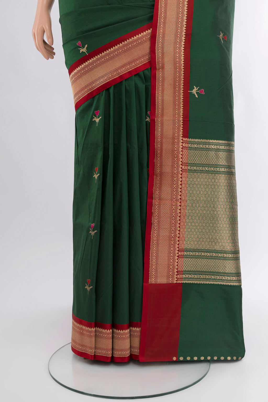 Pleats and pallu of Bottle Green Banarasi Katan Silk Saree with Zari Butta on the body and Zari Border. 
