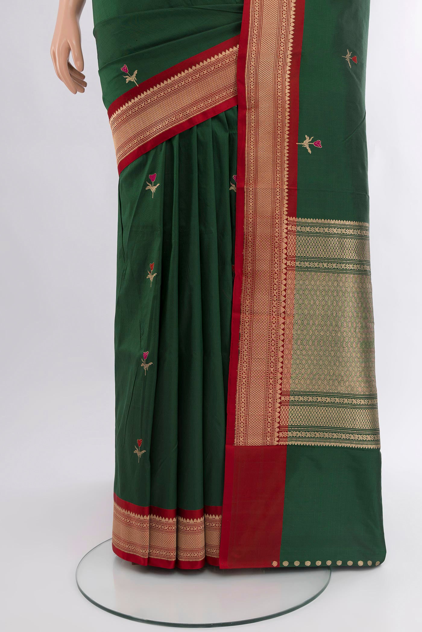 Pleats and pallu of Bottle Green Banarasi Katan Silk Saree with Zari Butta on the body and Zari Border. 