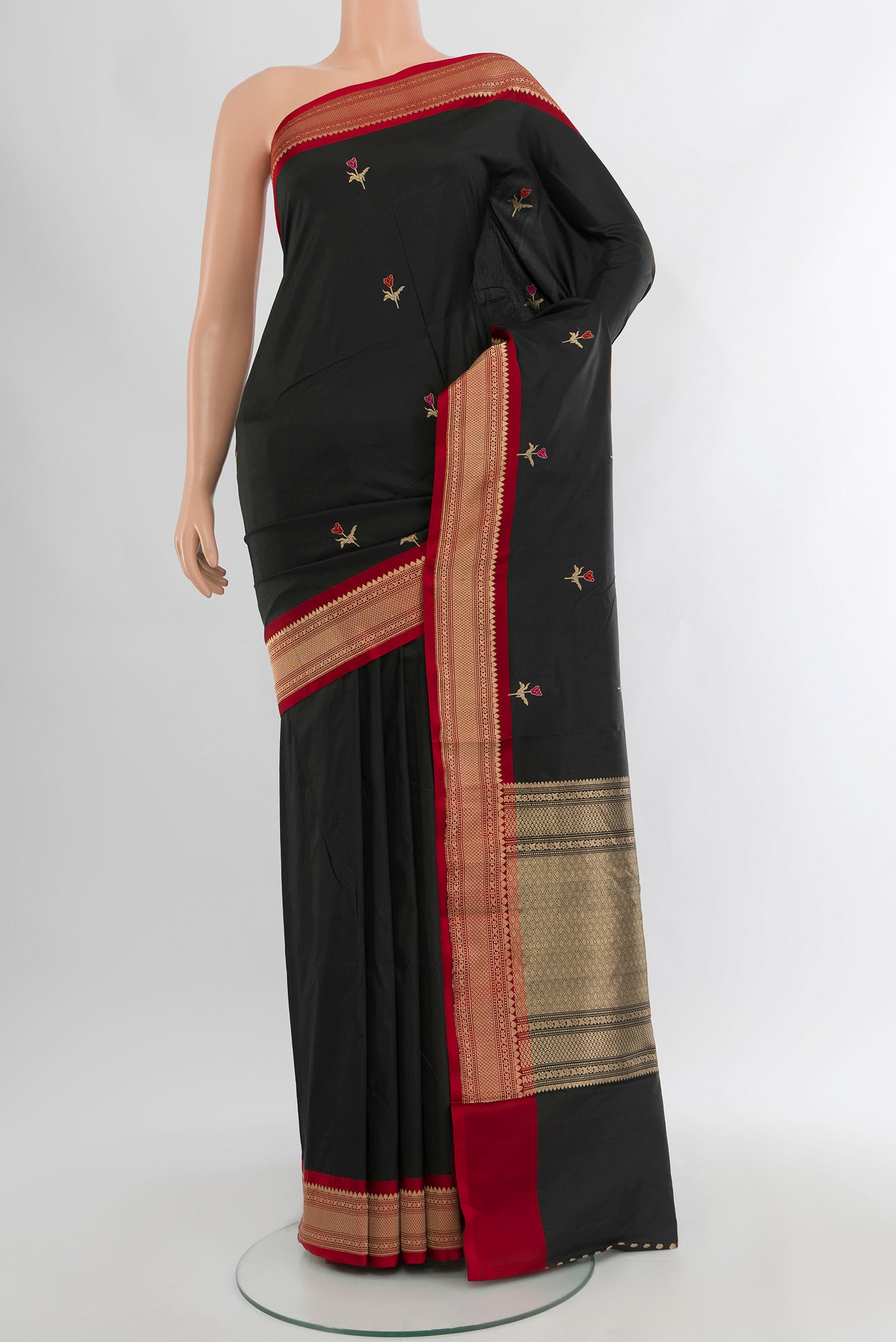 Black Banarasi Katan Silk Saree with Zari Butta on the body and Zari Border.  displayed on a mannequin