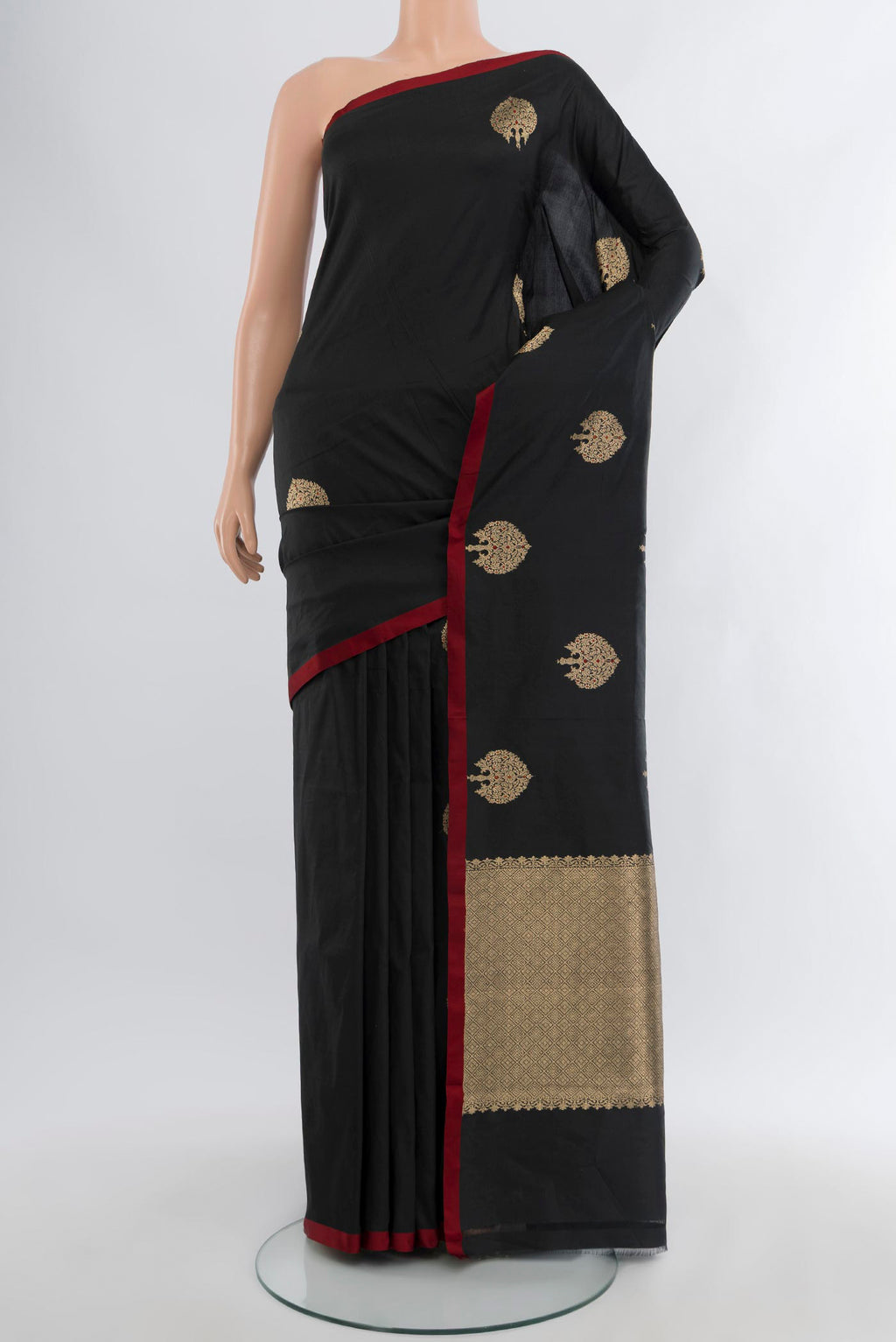 Black Banarasi Katan Silk Saree with Zari Butta on the body and Without Border.  displayed on a mannequin