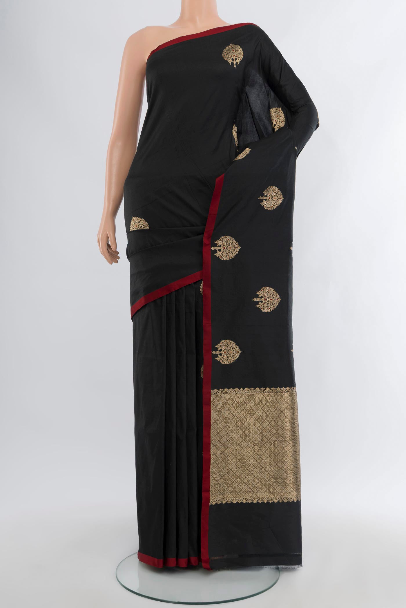Black Banarasi Katan Silk Saree with Zari Butta on the body and Without Border.  displayed on a mannequin