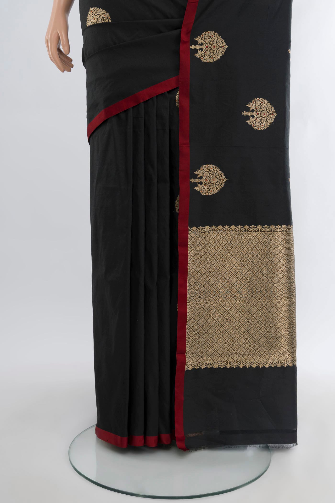 Pleats and pallu of Black Banarasi Katan Silk Saree with Zari Butta on the body and Without Border. 