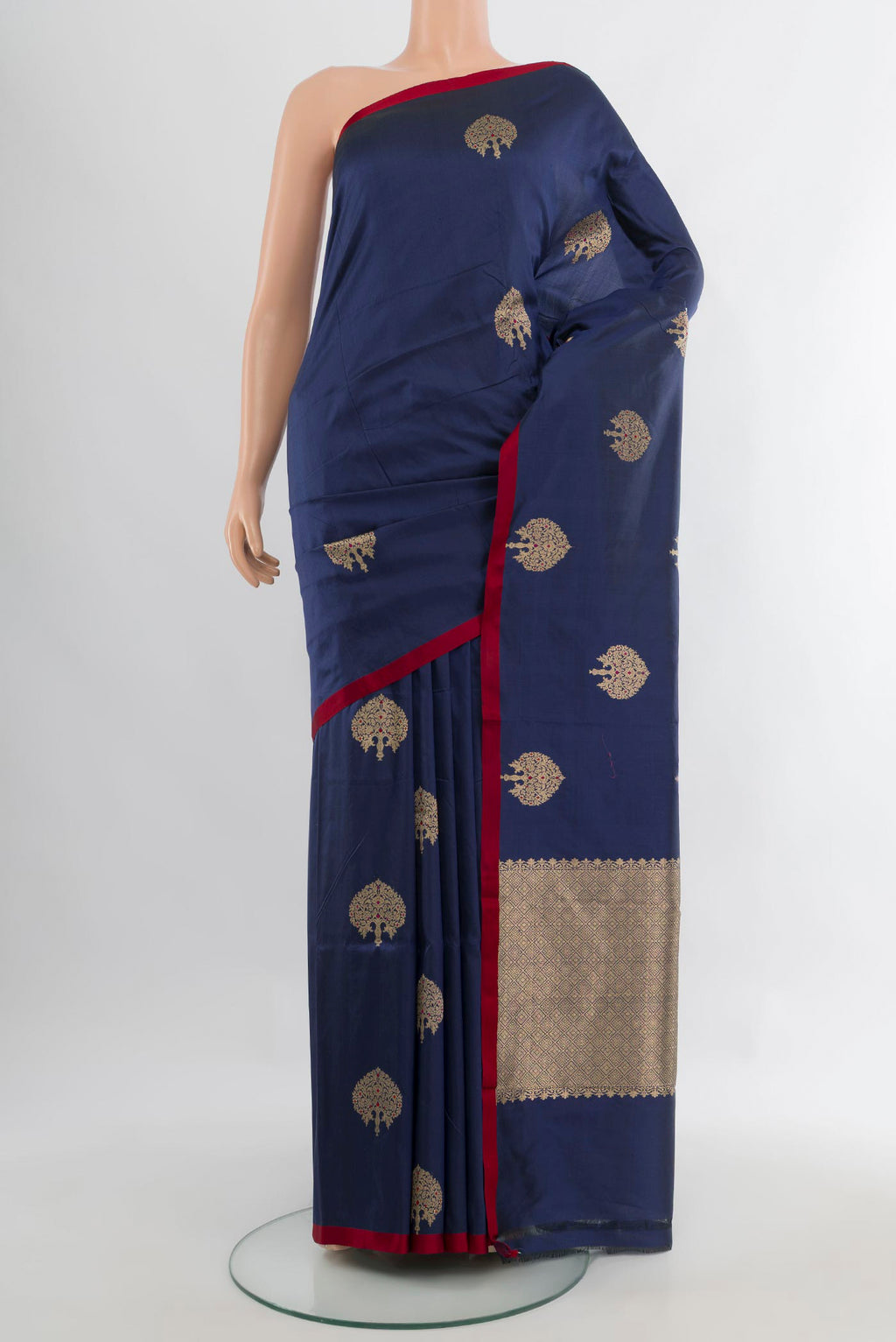 Pure Silk Navy Blue Banarasi Katan Saree with Zari Butta on the body and Without Border.  displayed on a mannequin