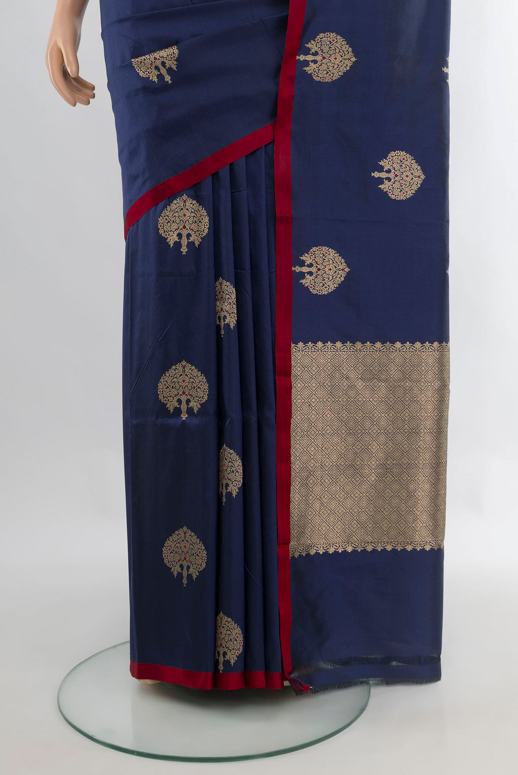 Pleats and pallu of Pure Silk Navy Blue Banarasi Katan Saree with Zari Butta on the body and Without Border. 
