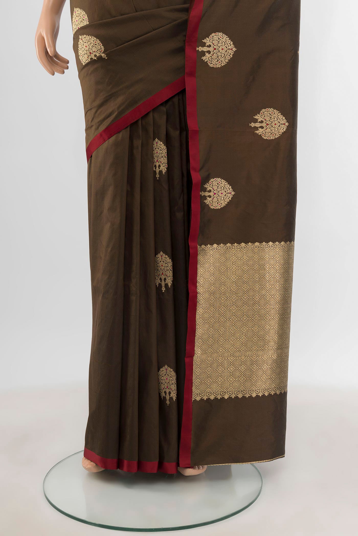 Pleats and pallu of Brown Banarasi Katan Silk Saree with Zari Butta on the body and Plain Border. 