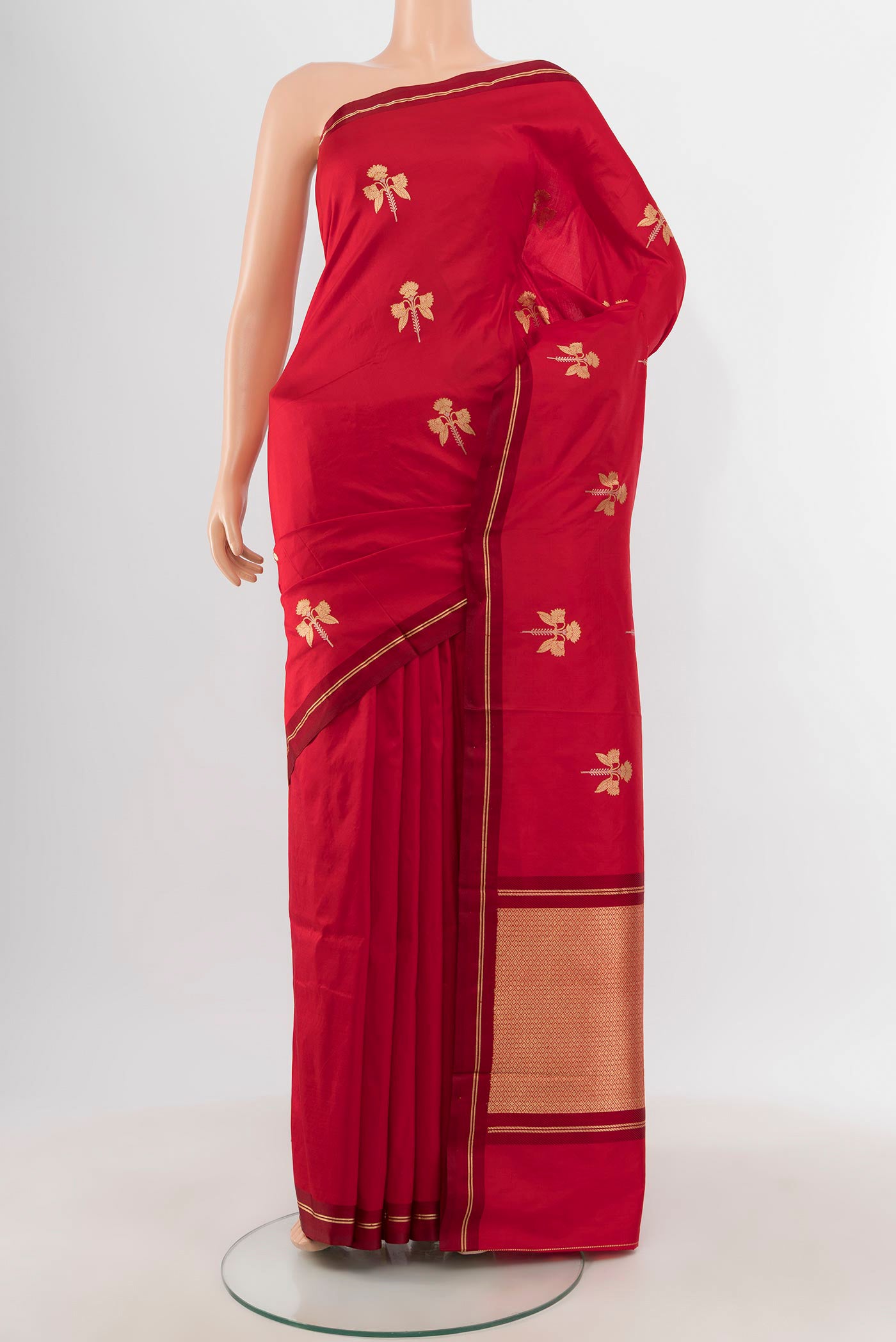 Red Banarasi Katan Silk Saree with Zari Butta on the body and Thin Zari Line.  displayed on a mannequin