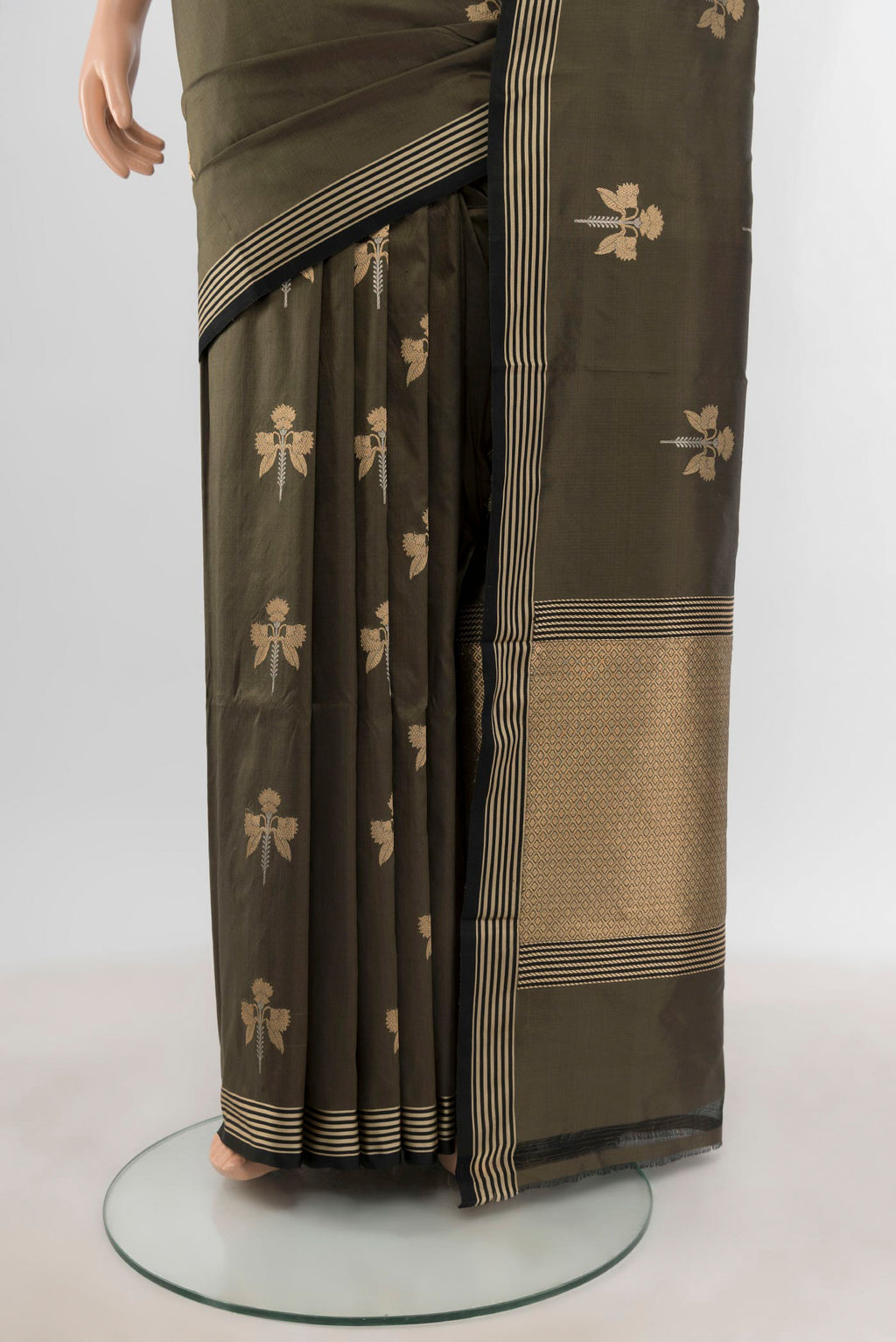 Pleats and pallu of Olive Green Banarasi Katan Silk Saree with Zari Butta on the body and Thin Zari Line. 
