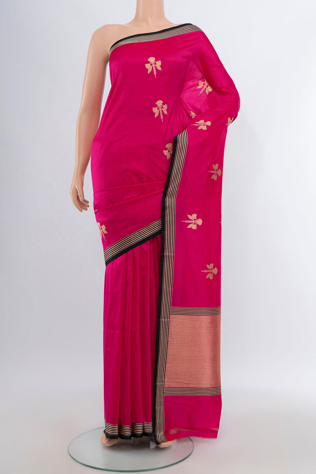 Rani Pink Banarasi Katan Silk Saree with Zari Butta on the body and Temple Border.  displayed on a mannequin