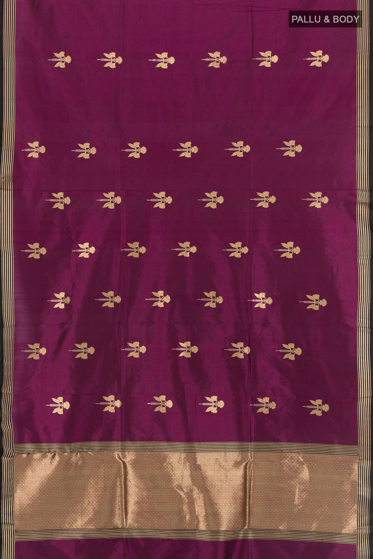 Flat view of Purple Banarasi Katan Silk Saree with Zari Butta on the body and Zari Border. 