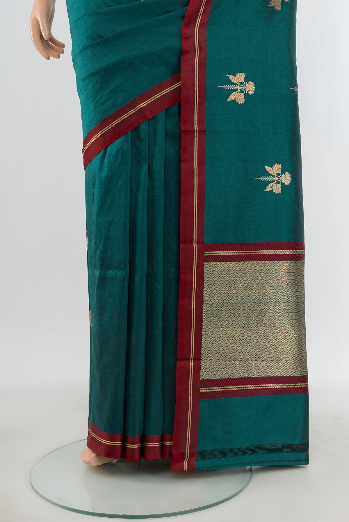Pleats and pallu of Teal Banarasi Katan Silk Saree with Zari Butta on the body and Plain Border. 