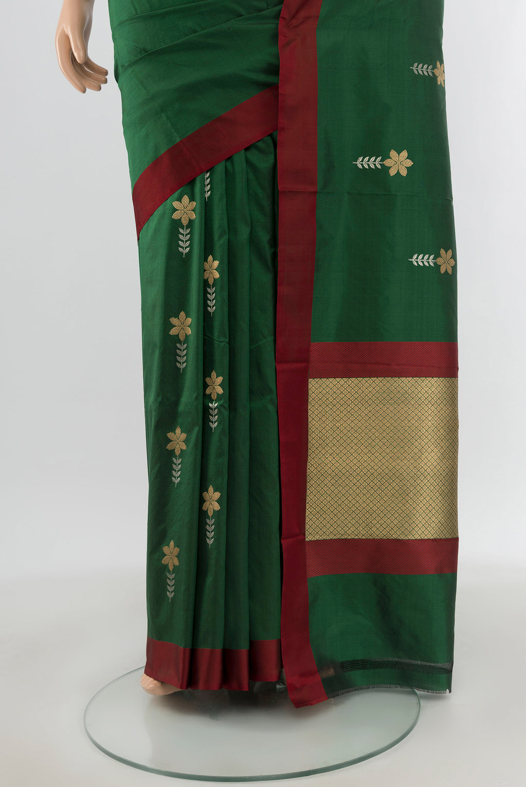Pleats and pallu of Bottle Green Banarasi Katan Silk Saree with Zari Butta on the body and Plain Border. 