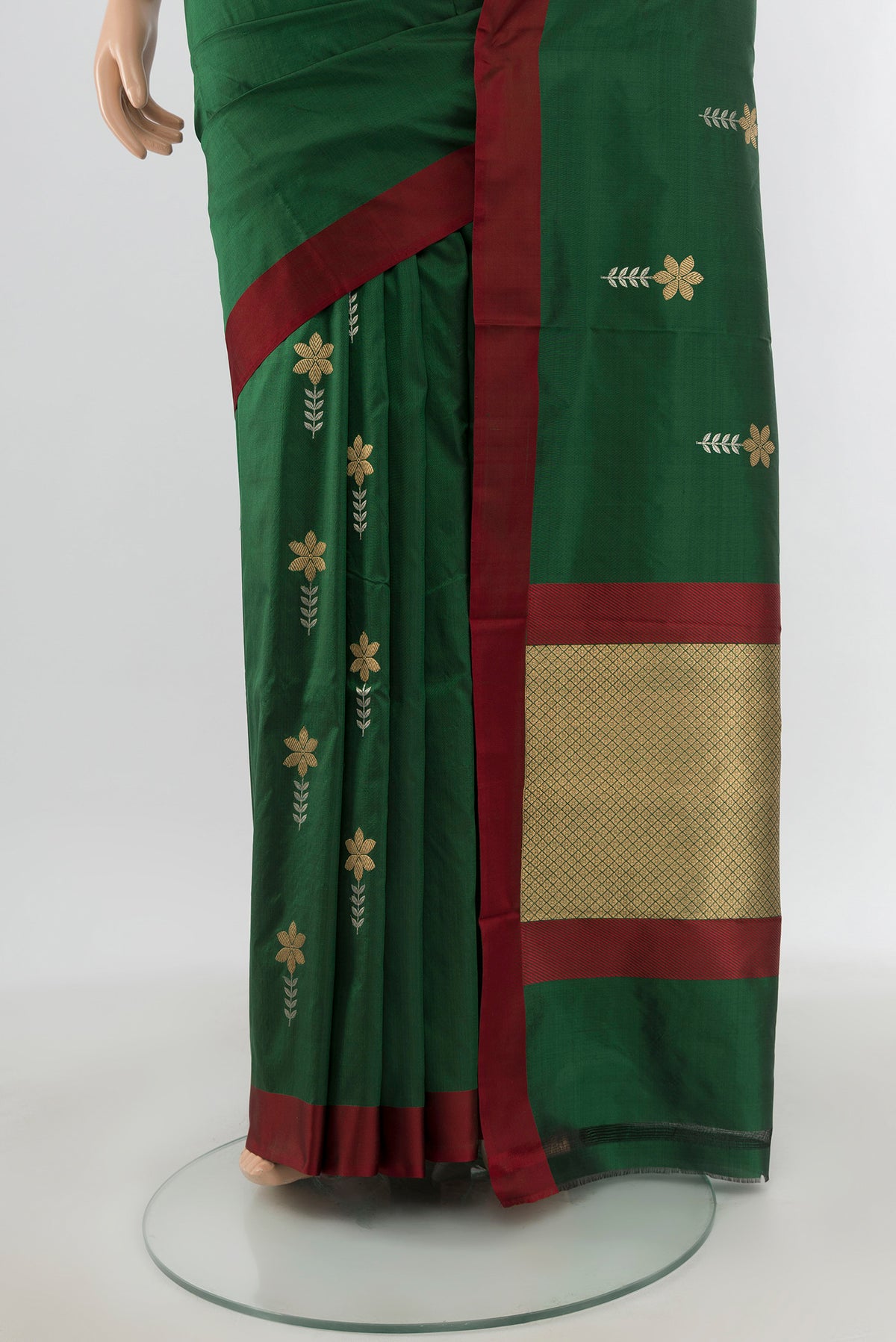 Pleats and pallu of Bottle Green Banarasi Katan Silk Saree with Zari Butta on the body and Plain Border. 