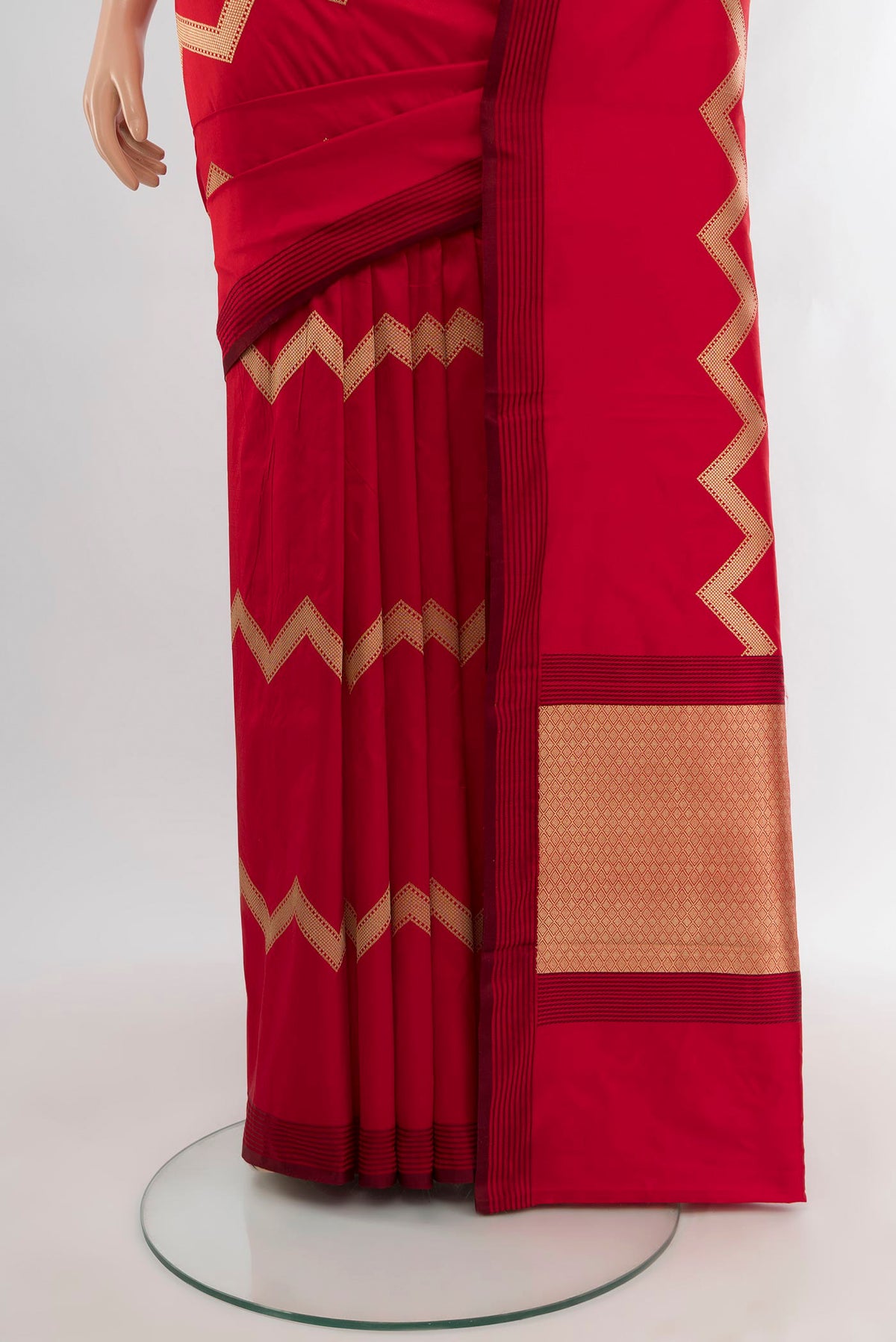 Pleats and pallu of Red Banarasi Katan Silk Saree with Zig Zag design on the body and Plain Border. 